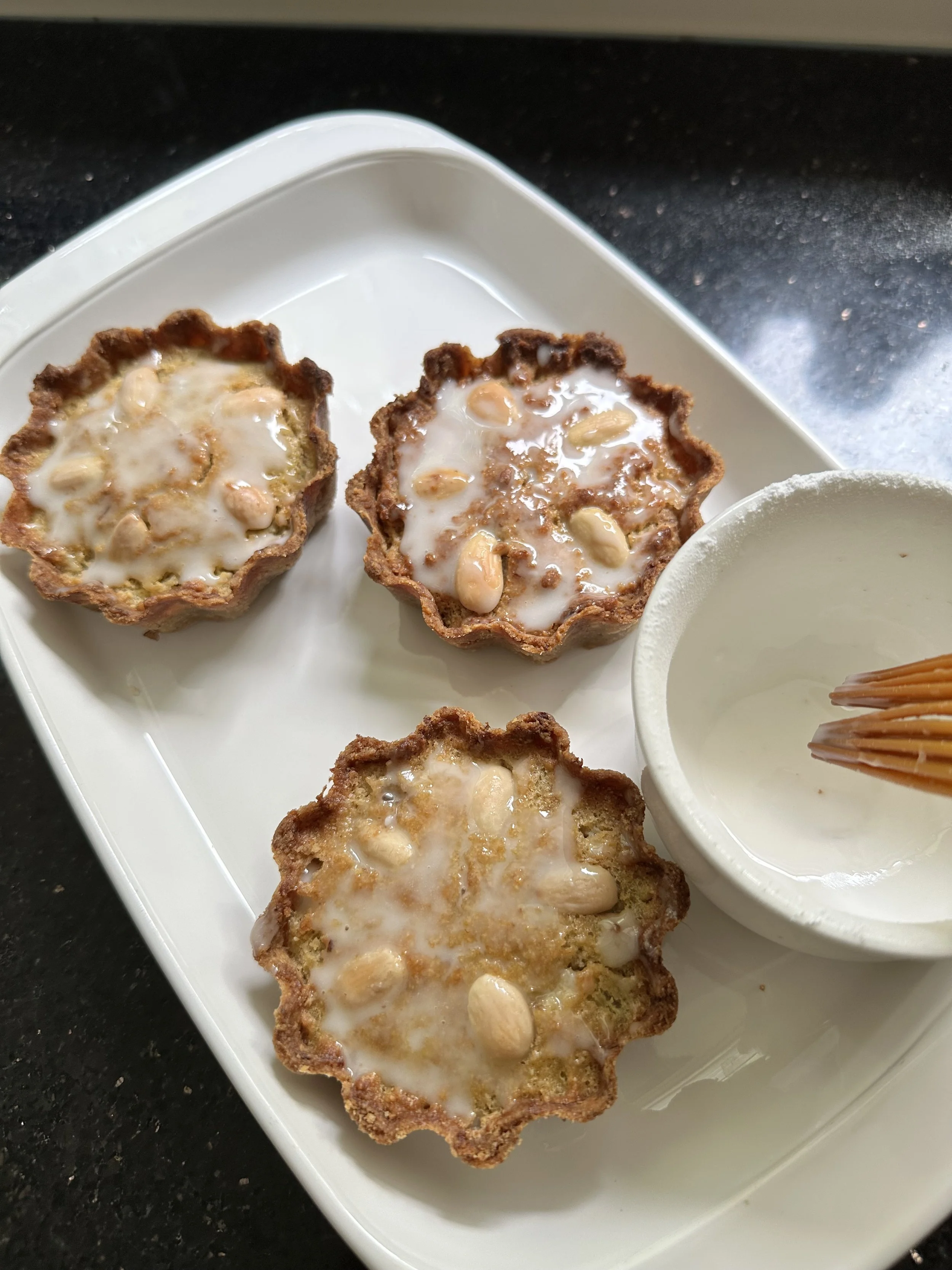 painting the tarts w/ water icing