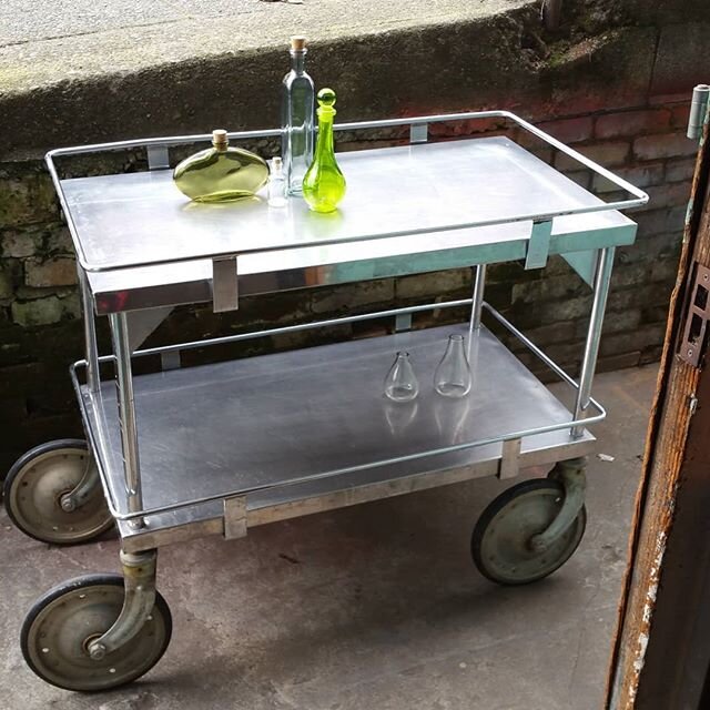 Just in. .... a 1950s stainless  bar cart with extra large wheels and stylish rails on each level. Measures 21x37x33 tall.

#vintagefinds #vintageseattle #seattlemcm #mcm #madmen#stainlessbarcart#artdeco