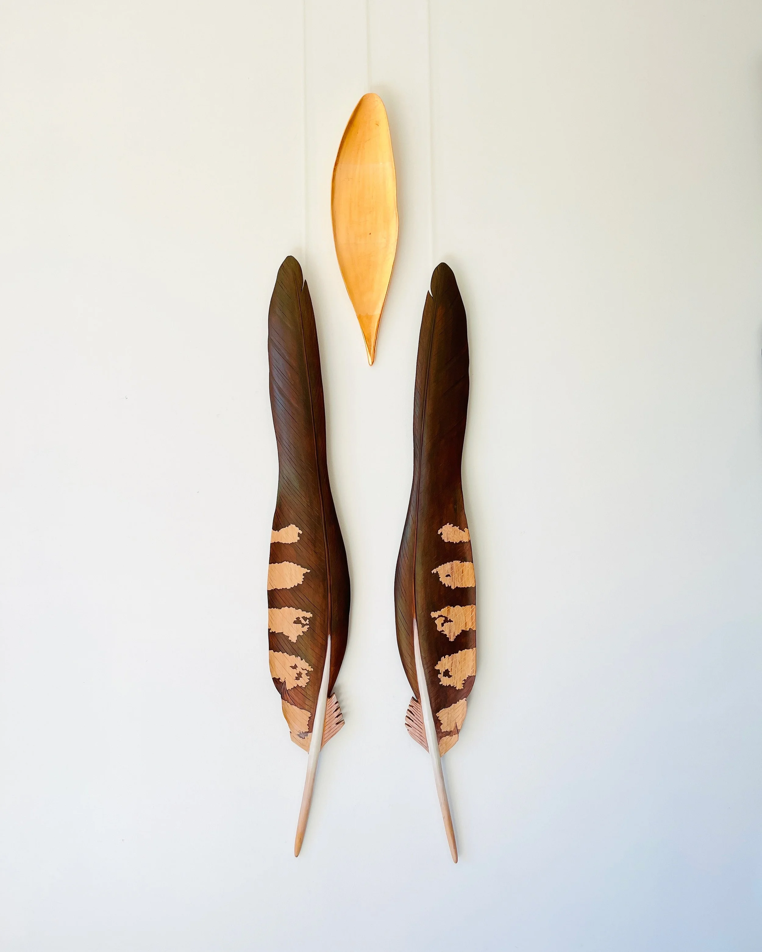'Union', installation 2024, matai, kauri, acrylic paint, copper leaf. Available from Black Door Gallery Auckland. 