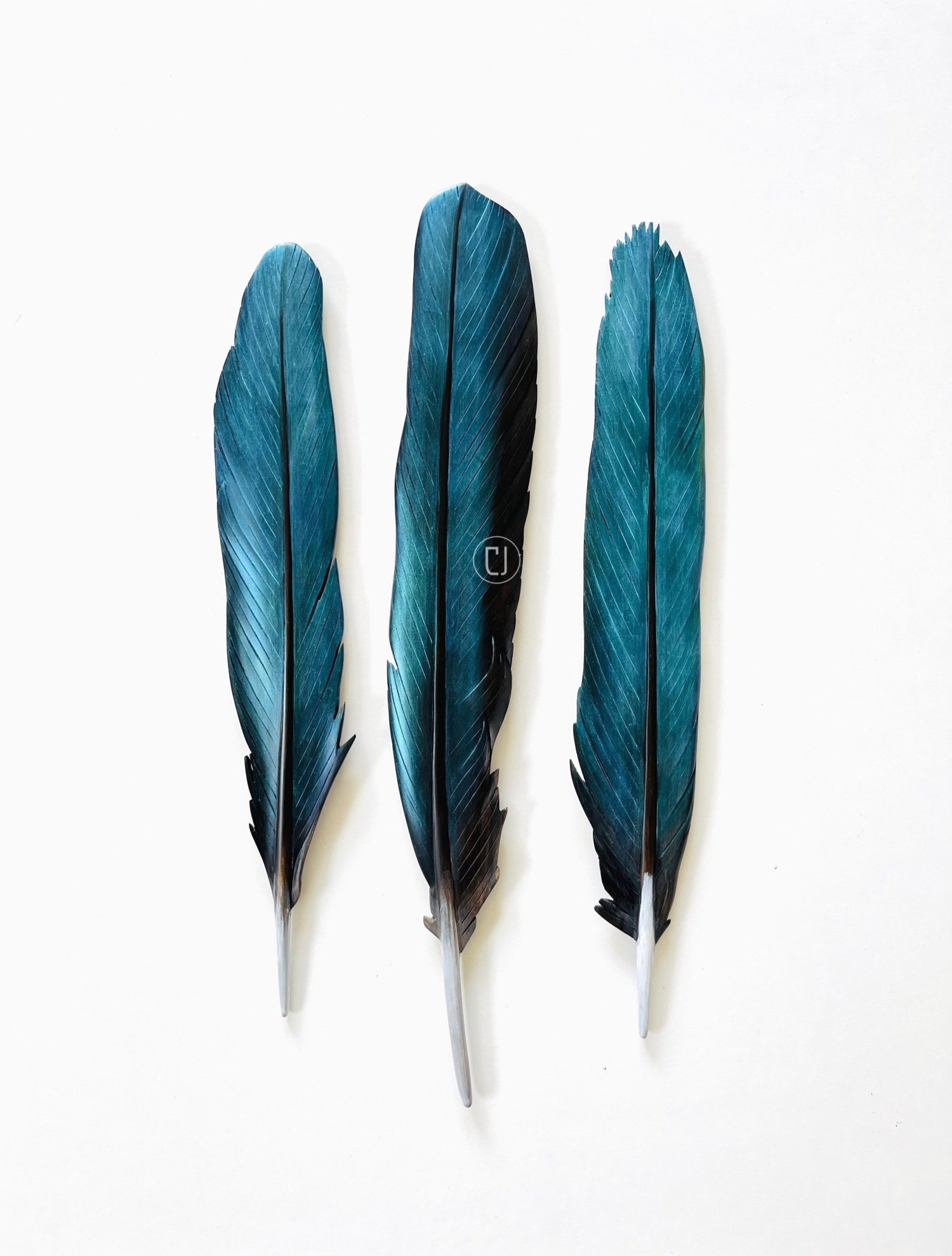 collection+of+kingfisher+feather+carvings+by+Claire+Jensen+Art+Taranaki+NZ.jpg