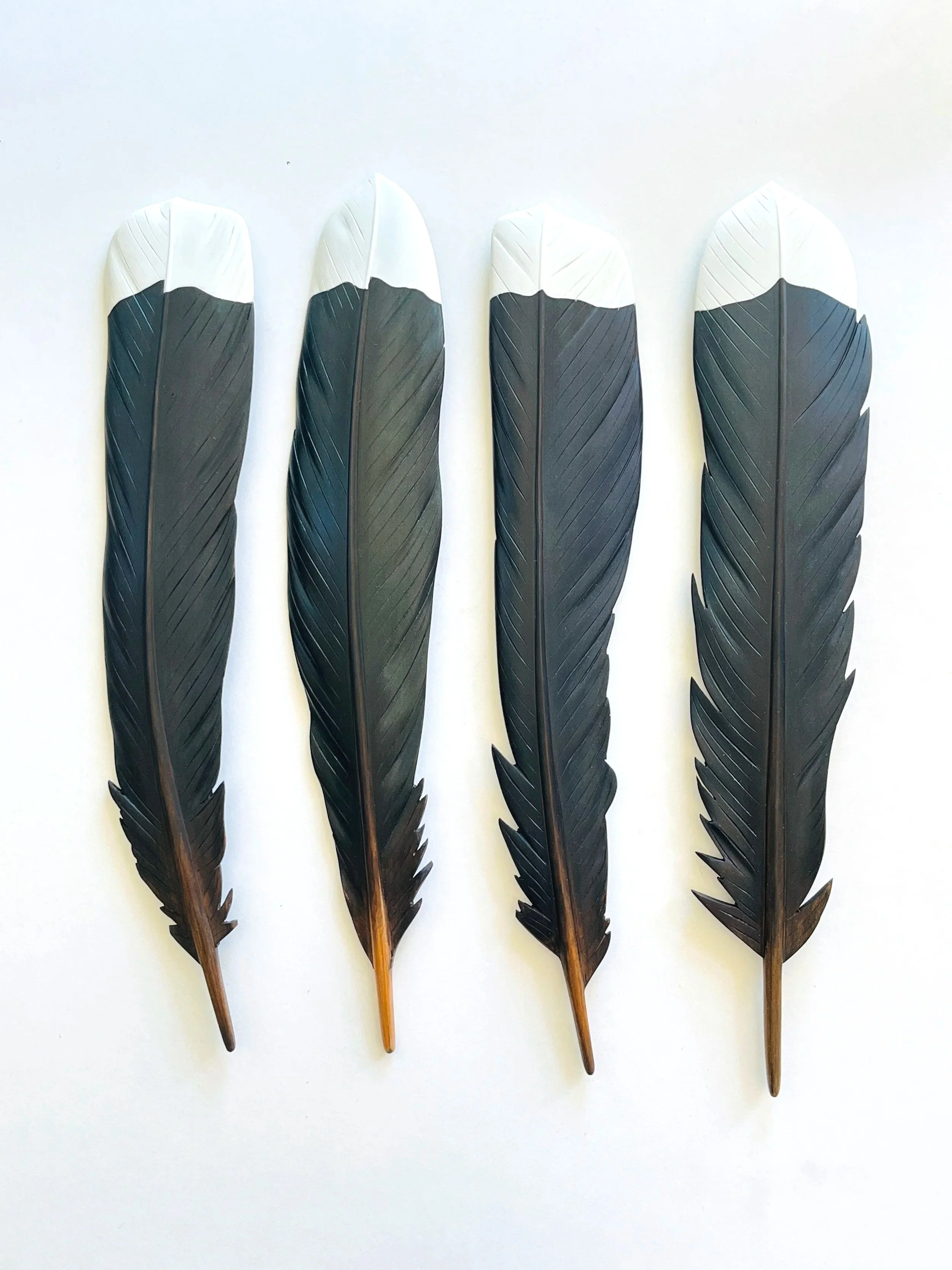 carved wooden huia feather wall art by claire jensen opunake
