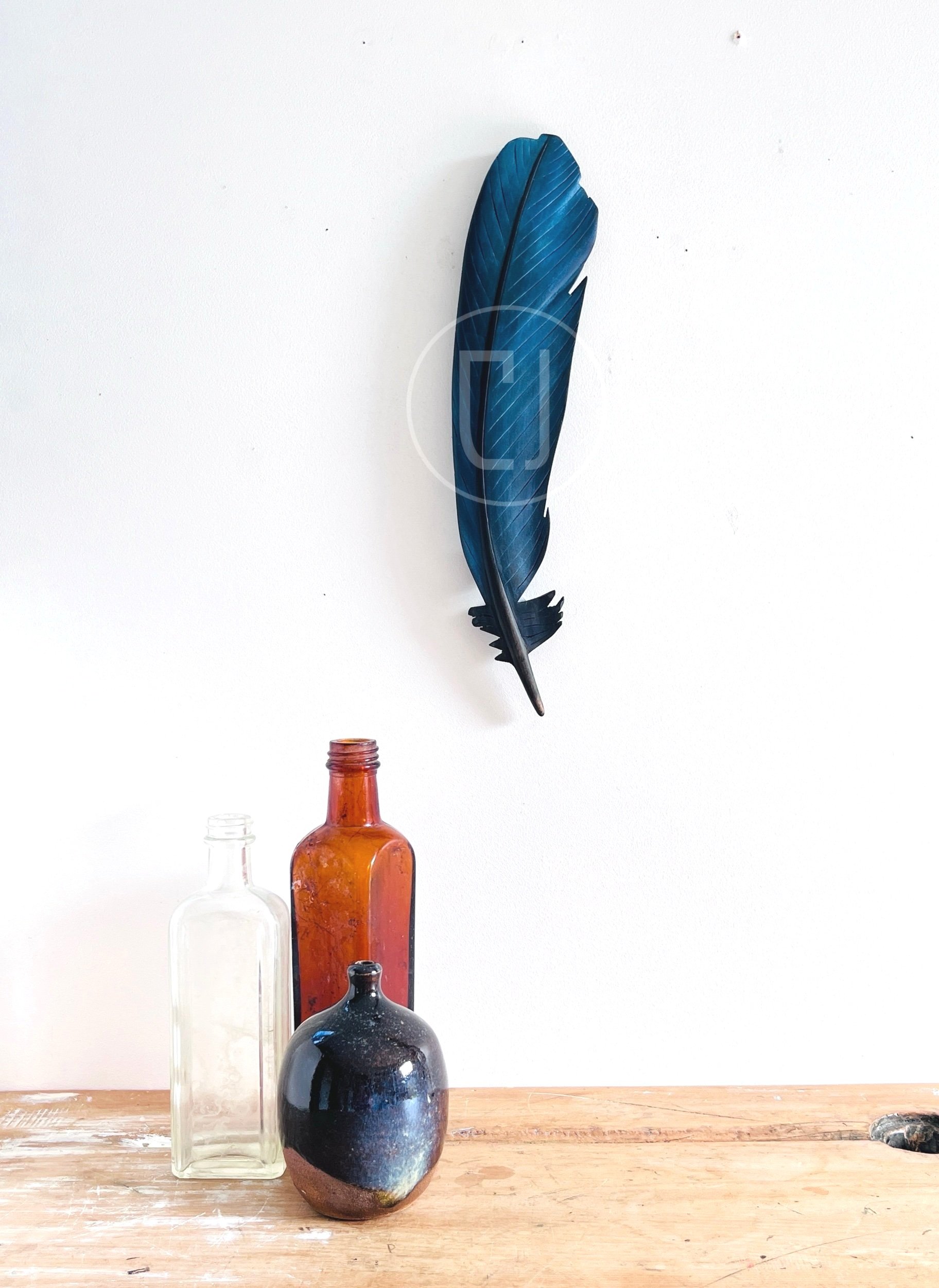 Prosthemadera+novaeseelandiae+carved+feather+art.jpg