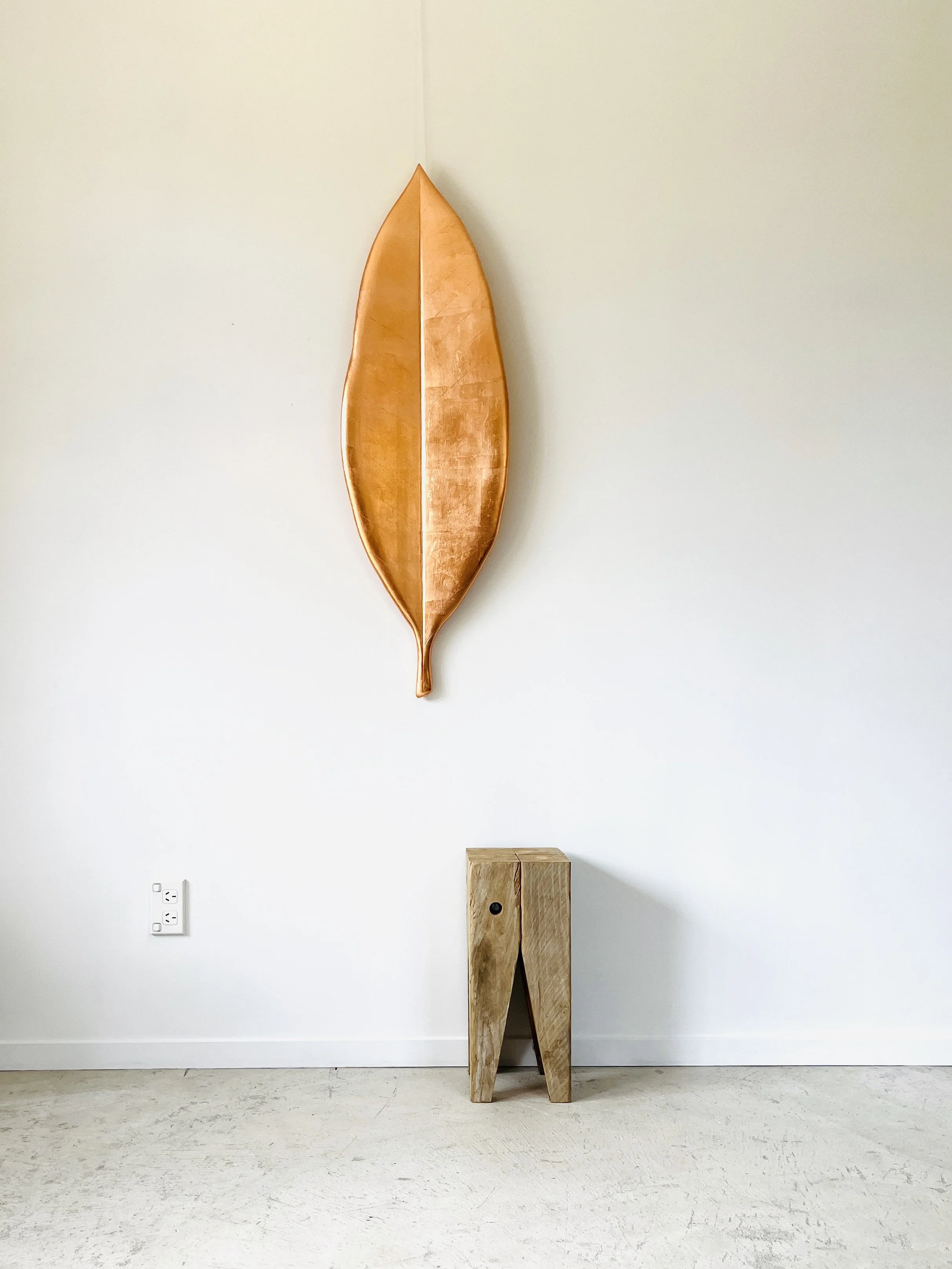 Copper gilded pohutakawa leaf made from native rimu timber. Commission for Kurawaka Waipapa hospital in Christchurch, 2024.