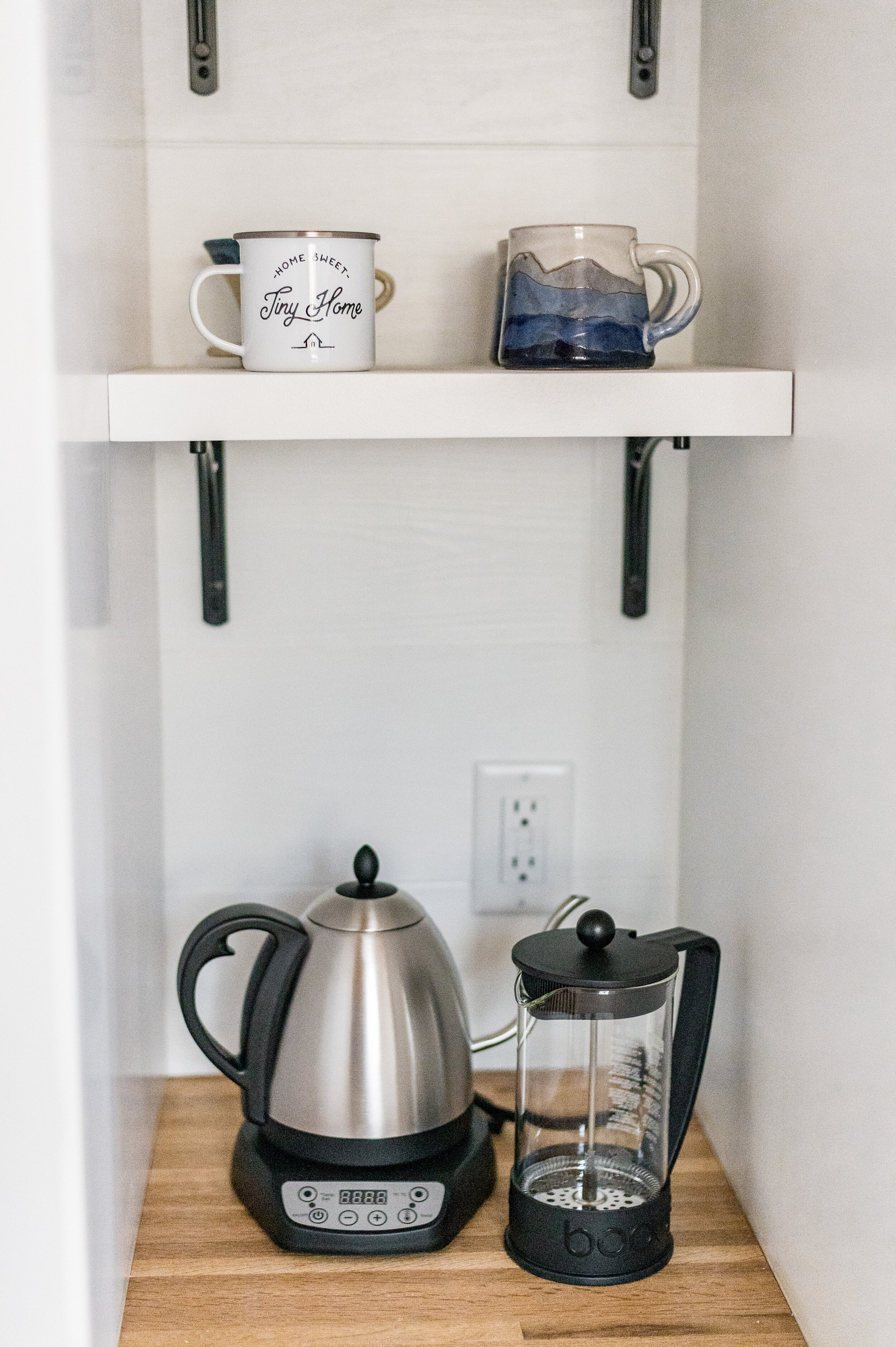 Craft coffee bar with temperature set gooseneck kettle, pour over cone, and french press.
