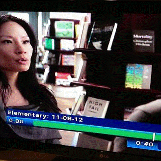 Lucy Liu checking out TOO HIGH TO FAIL on CBS’ new hit show Elementary last week. Now I’m waitin’ for the American Express spot offer: “When I’m in Colorado or Washington, I don’t always have cash.”