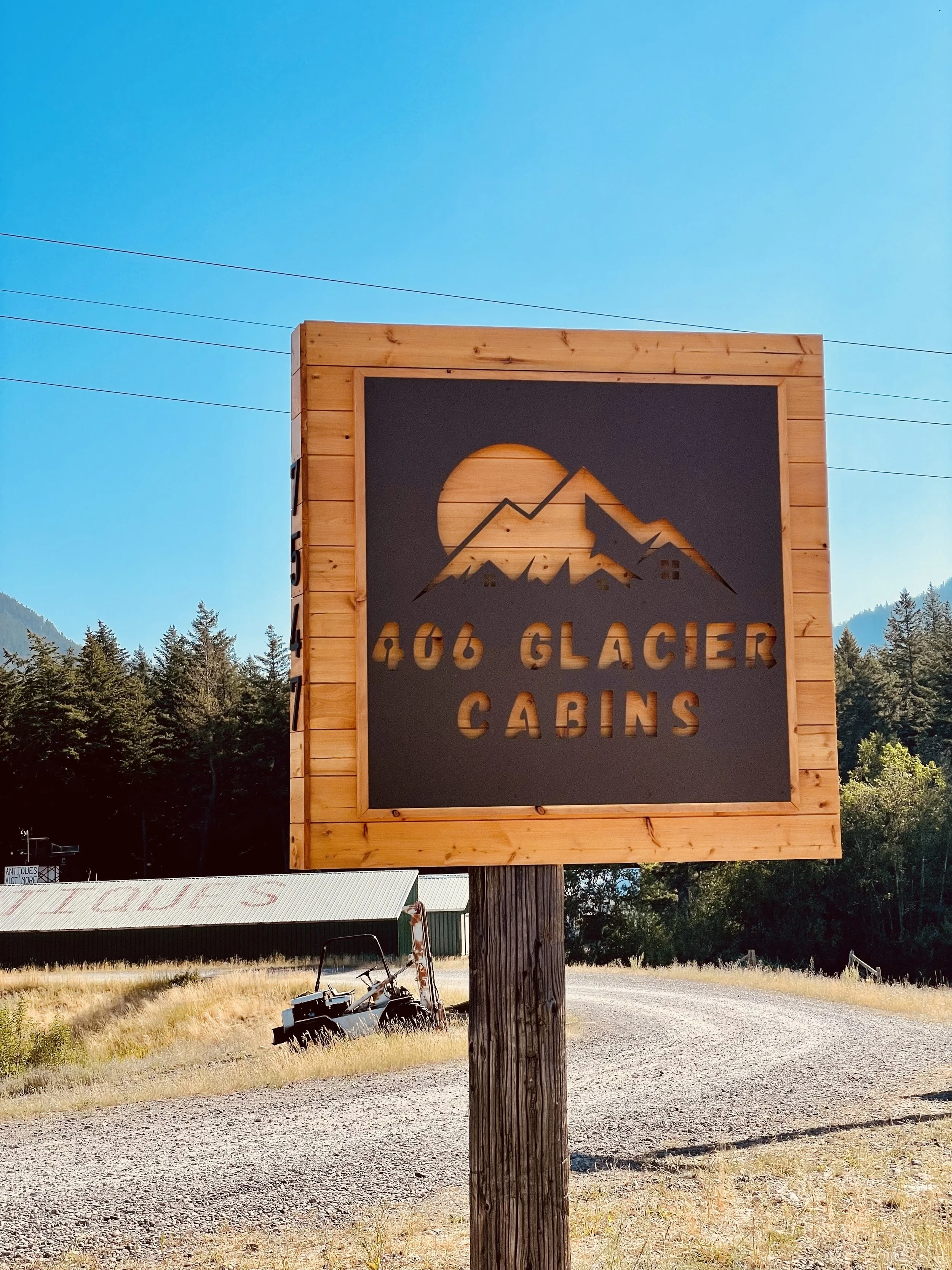 Custom metal business sign for 406 Glacier Cabins.jpeg