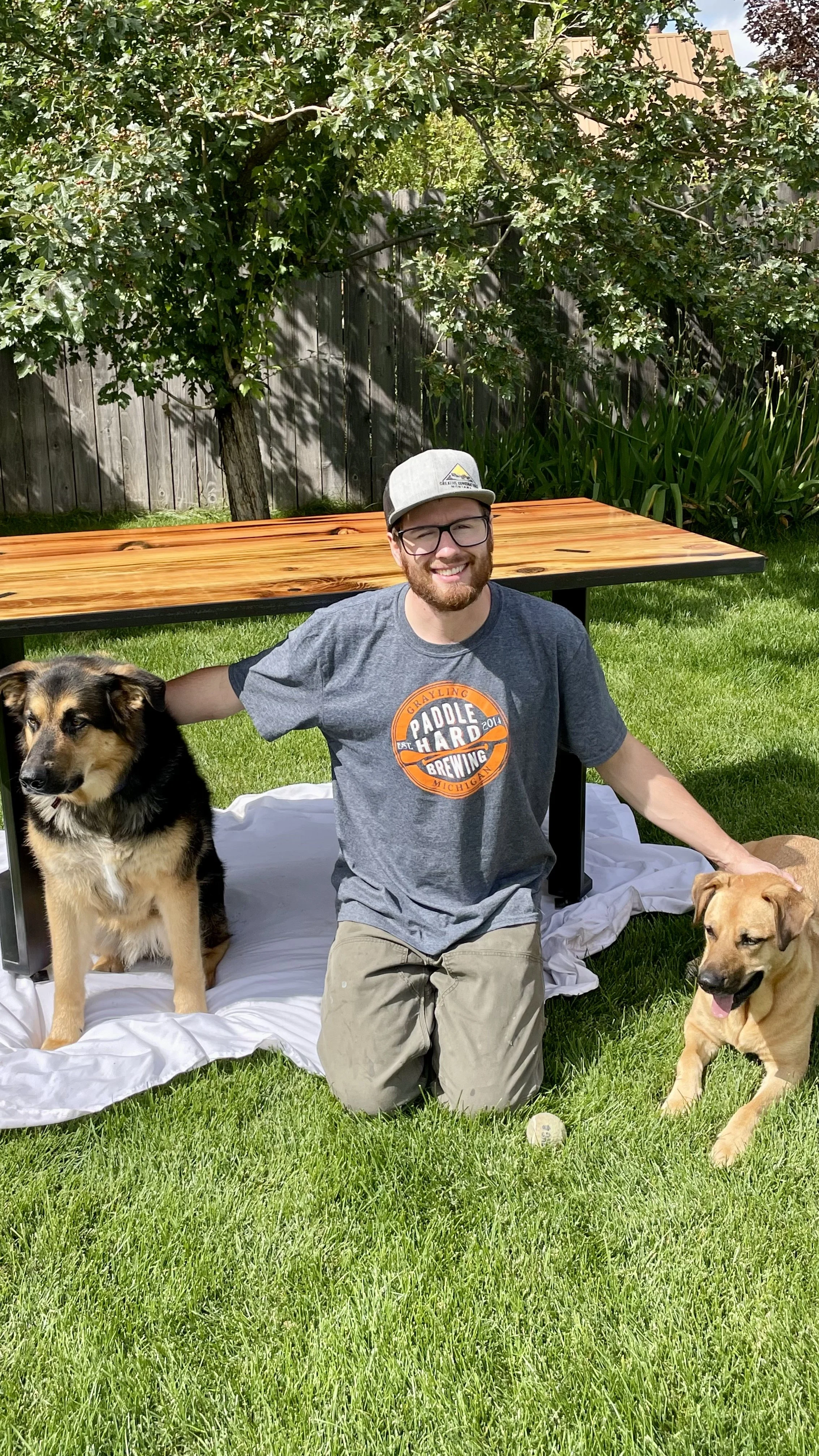 Glacier Metalwork owner Nate Stoltzfus and shop dogs.jpeg