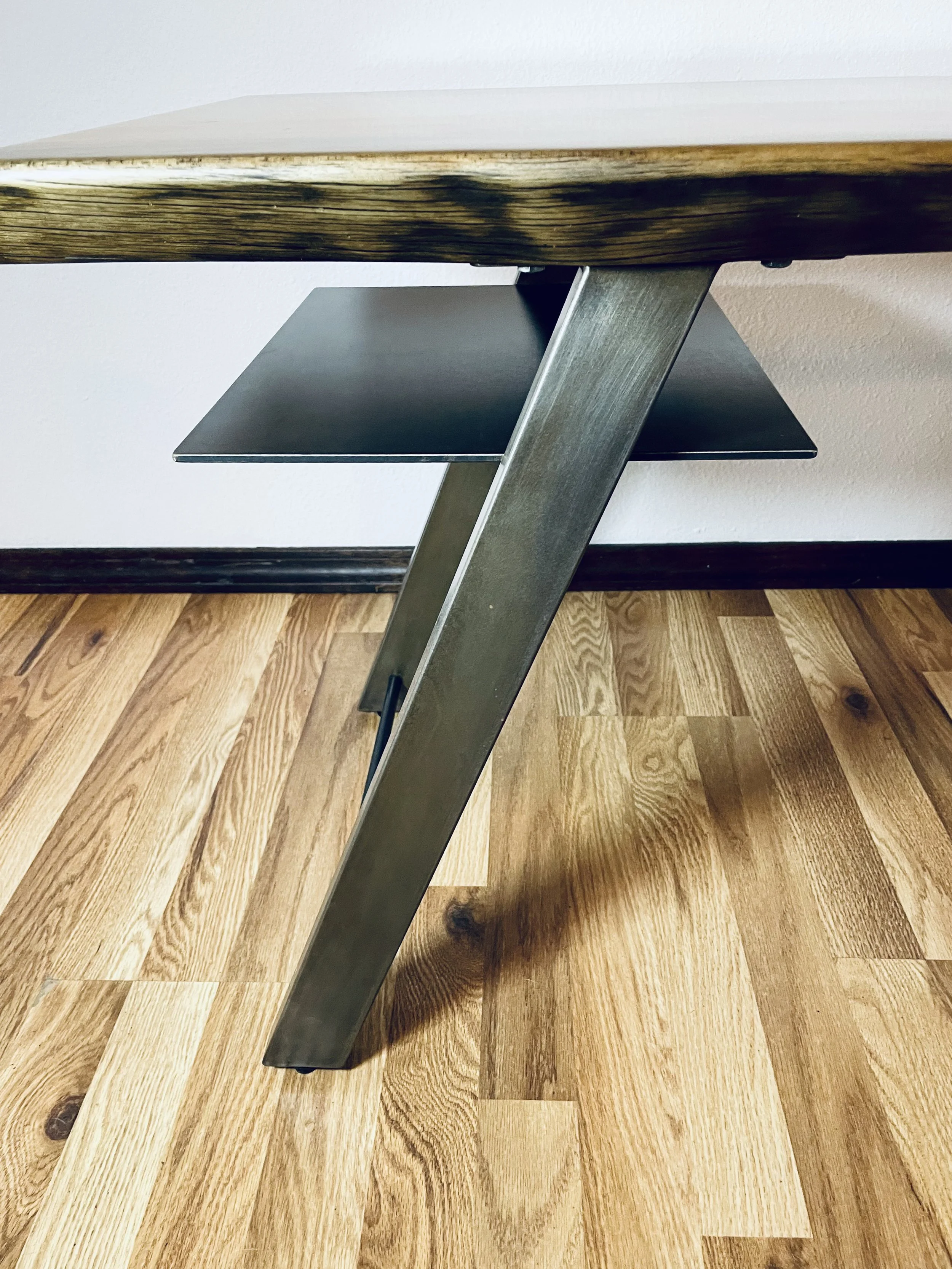 Close up of custom hand made pine slab and steel leg coffee table, design and hand crafted by Creative Combinations Montana.