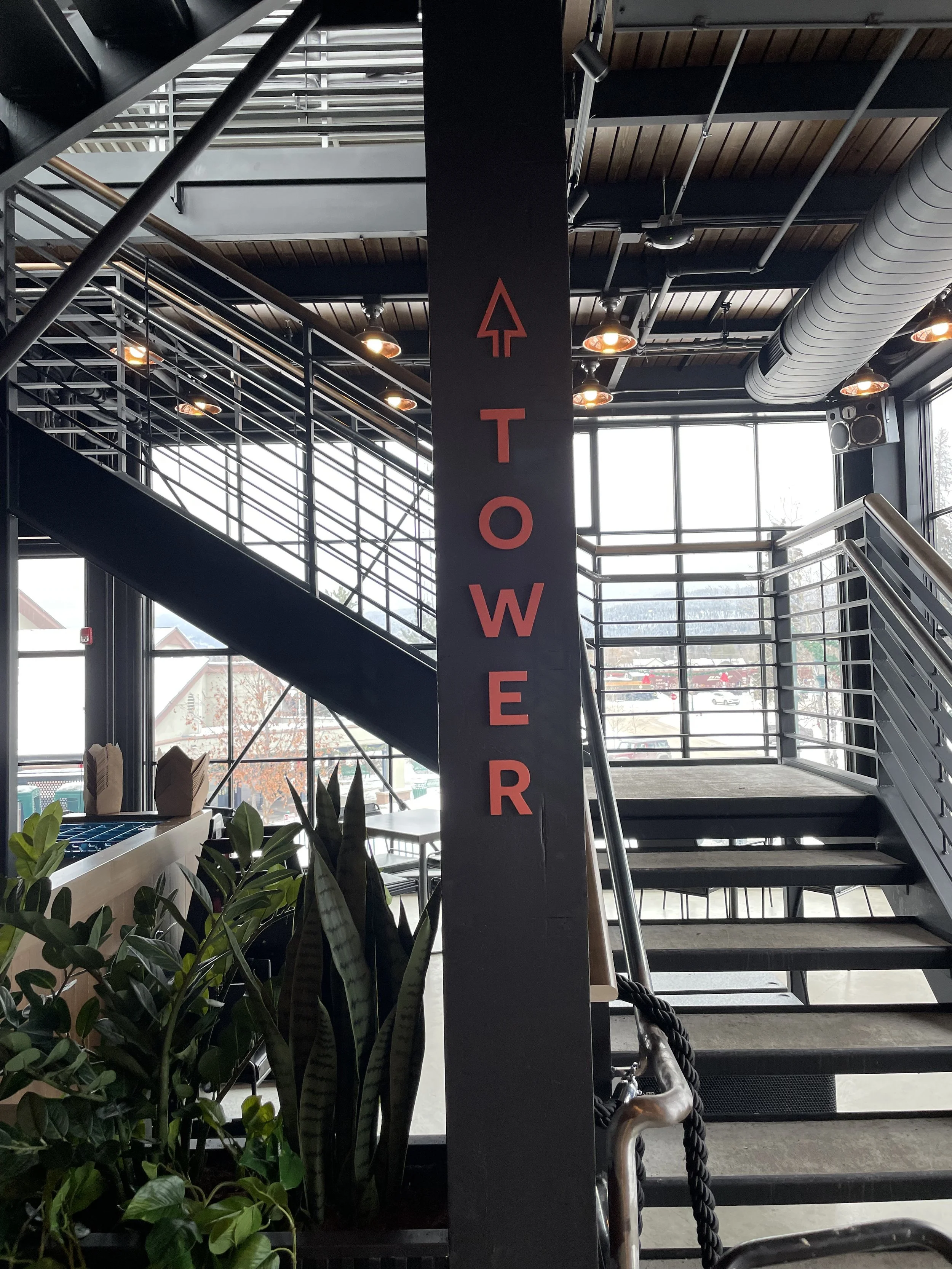 Custom steel "Tower" sign and directional arrow at Blackstar restaurant in downtown Whitefish Montana, fabricated and installed by Creative Combinations Montana.