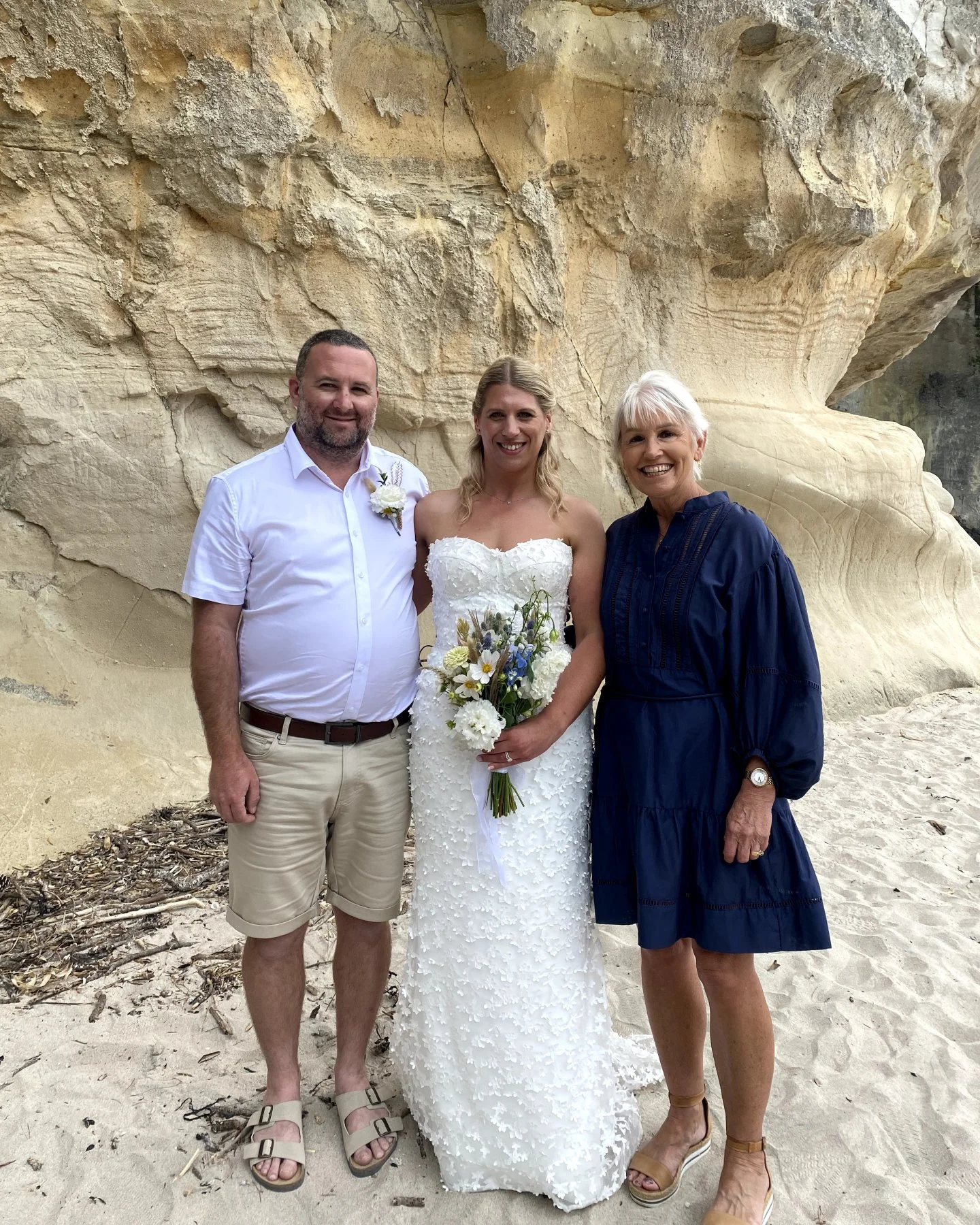 Kelsi &amp; Chris eloped to Cathedral Cove with their children, and so much love. 

They each gave a speech to each other's children. We were so engrossed in the ceremony that we didn't notice tourists had gathered around us - silently watching, not 