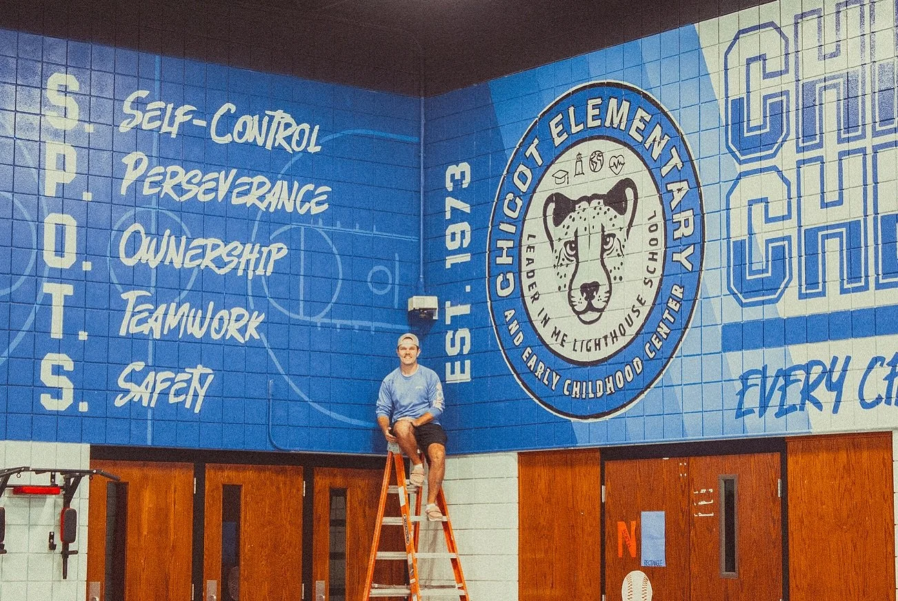Back to school means a new back-to-school mural! I&rsquo;m so happy with how this gym mural turned out at Chicot Elementary in Little Rock, Arkansas. Watching this piece come to life and bring so much energy to a room that was originally just stark w
