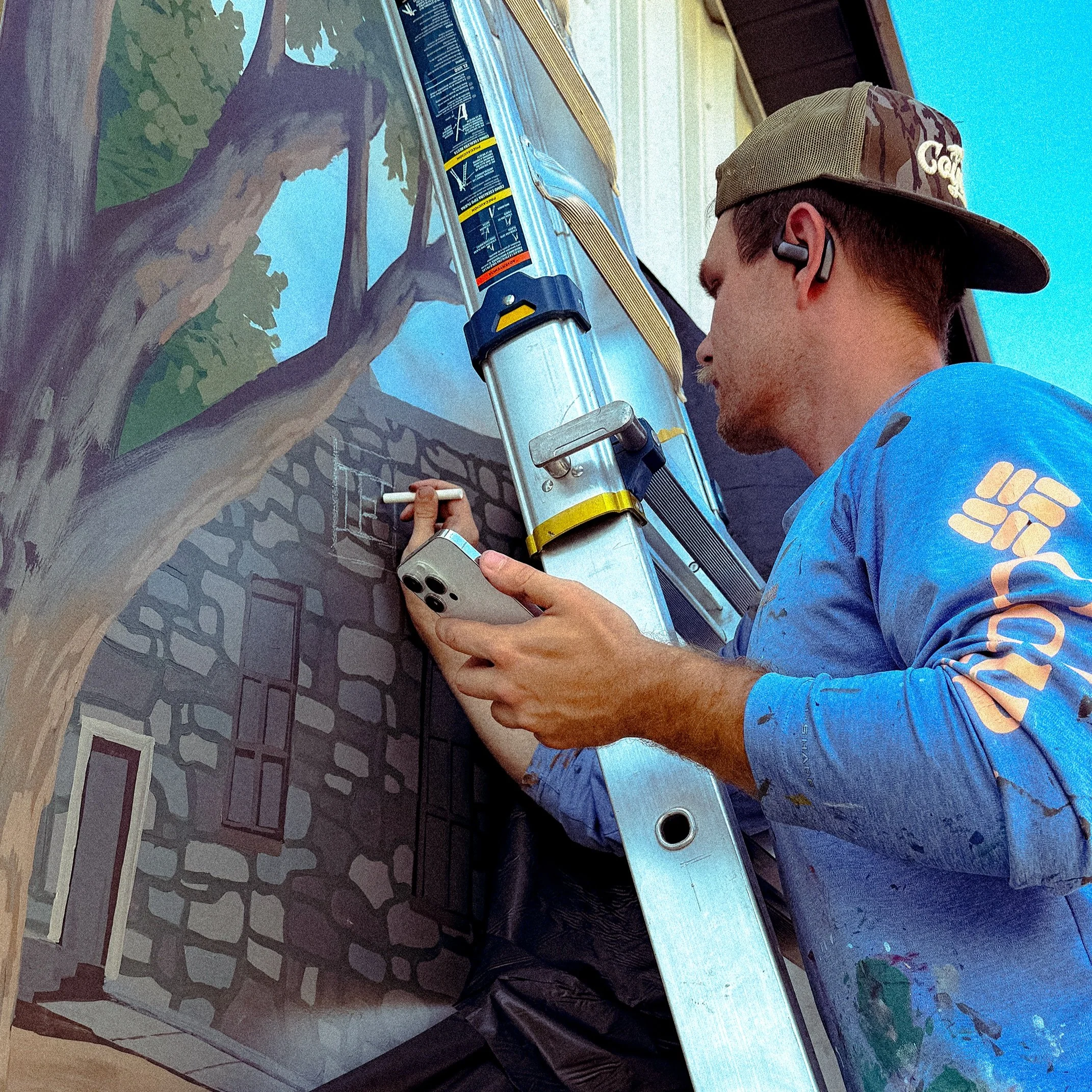 Painting a mural that&rsquo;s meant to represent a town takes a lot of communication, a lot of iterations, and a lot of trust. Thank you to Print and Stitch in Ellington, MO for trusting me with this project! It&rsquo;s one that has been in the works