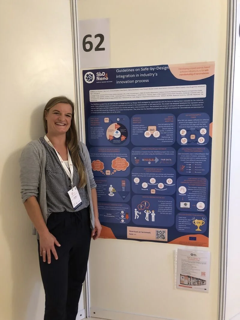 Researcher Eva Penssler in front of a scientific poster from an SSbD research project