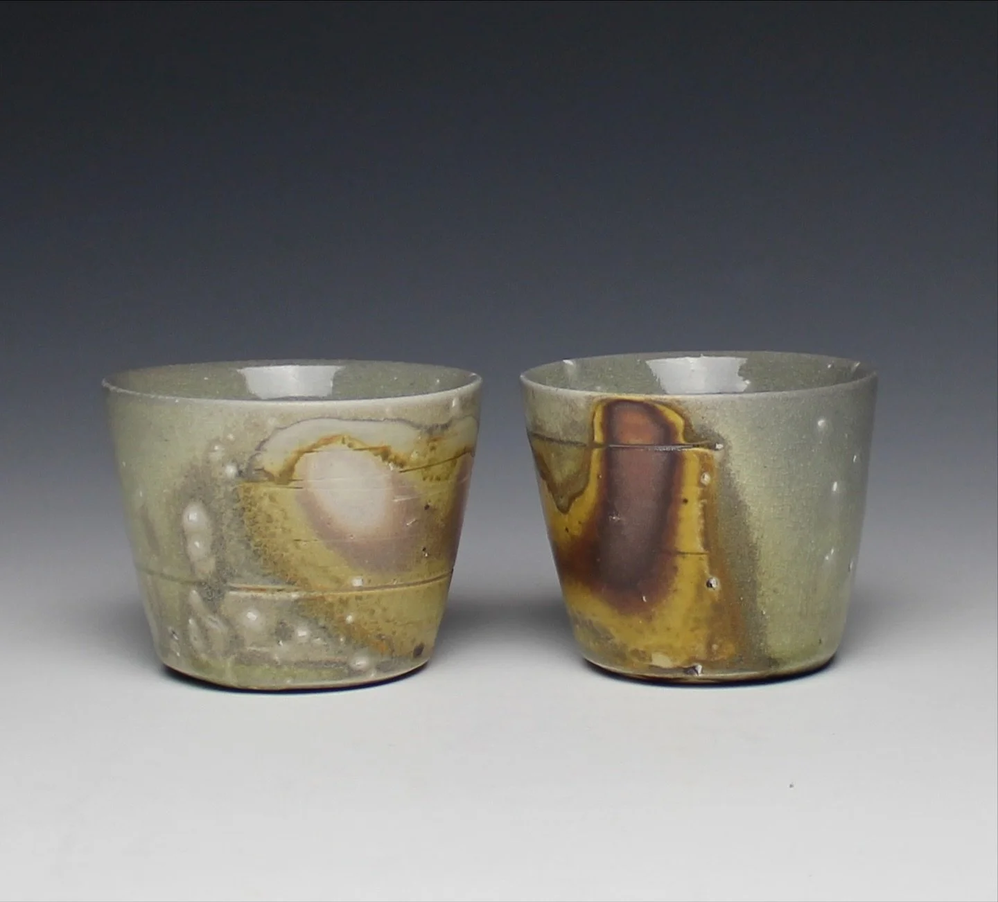 Wine cups with terra sigillatas made of wild clay I collected from a kaolinite mine in Mono County, CA. Both the white and purple are from different areas of the same mine. 

Come have a cup of wine with @laurenqn.ceramics and I and use one of these 