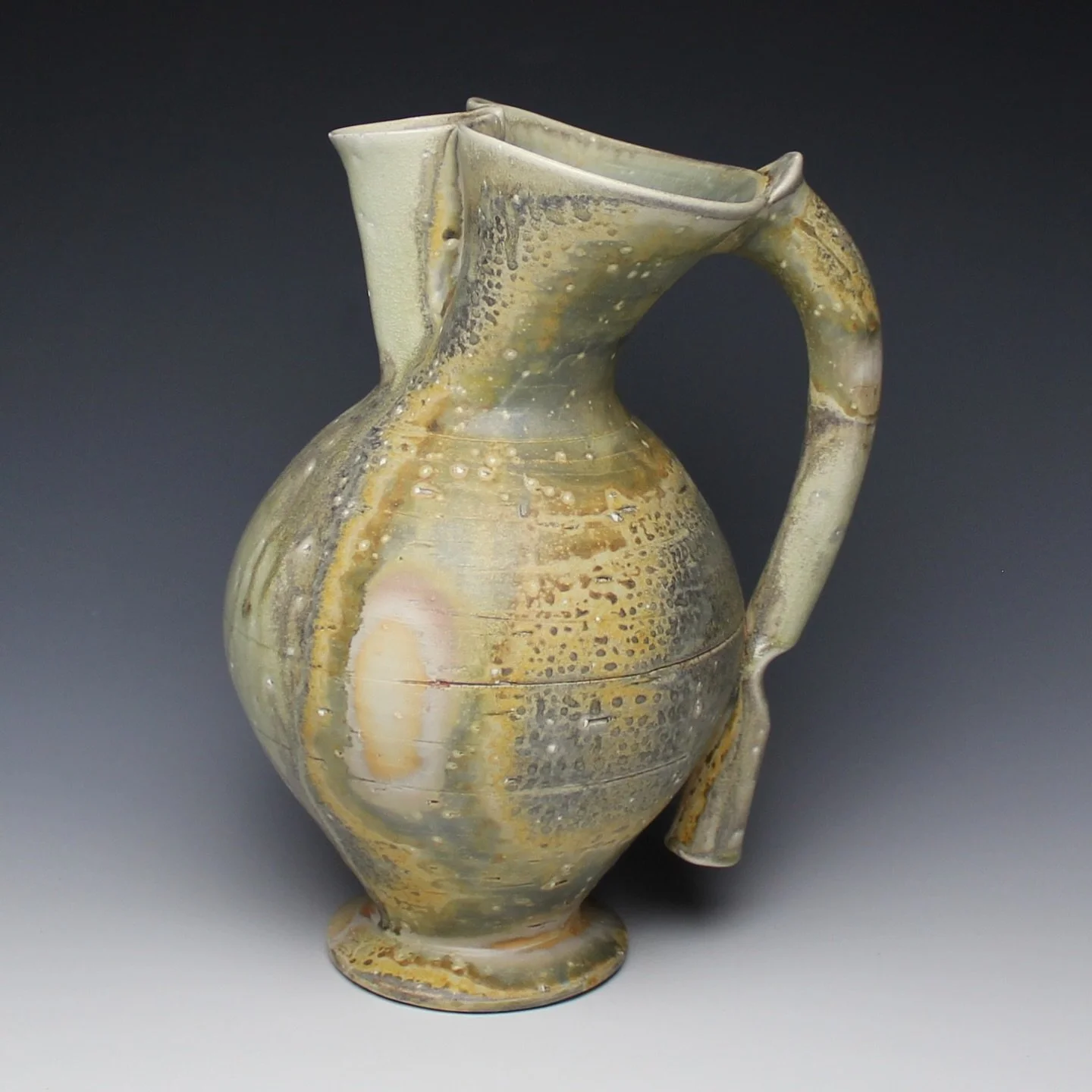 Jug with pinched rim. 

I always think of the rims of pots as a landscape. Pinching the rim or interrupting the rim with the handle placement add some narrative to this landscape. 

Available in my online shop - link in bio. 

#sodafiredpottery 
#ter