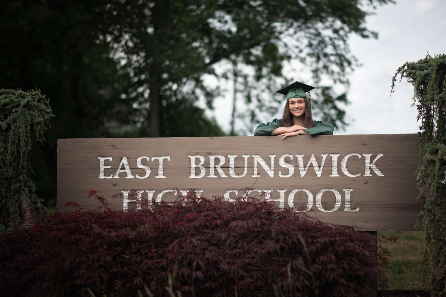 EBHS senior girl behind East Brunswick High School Sign