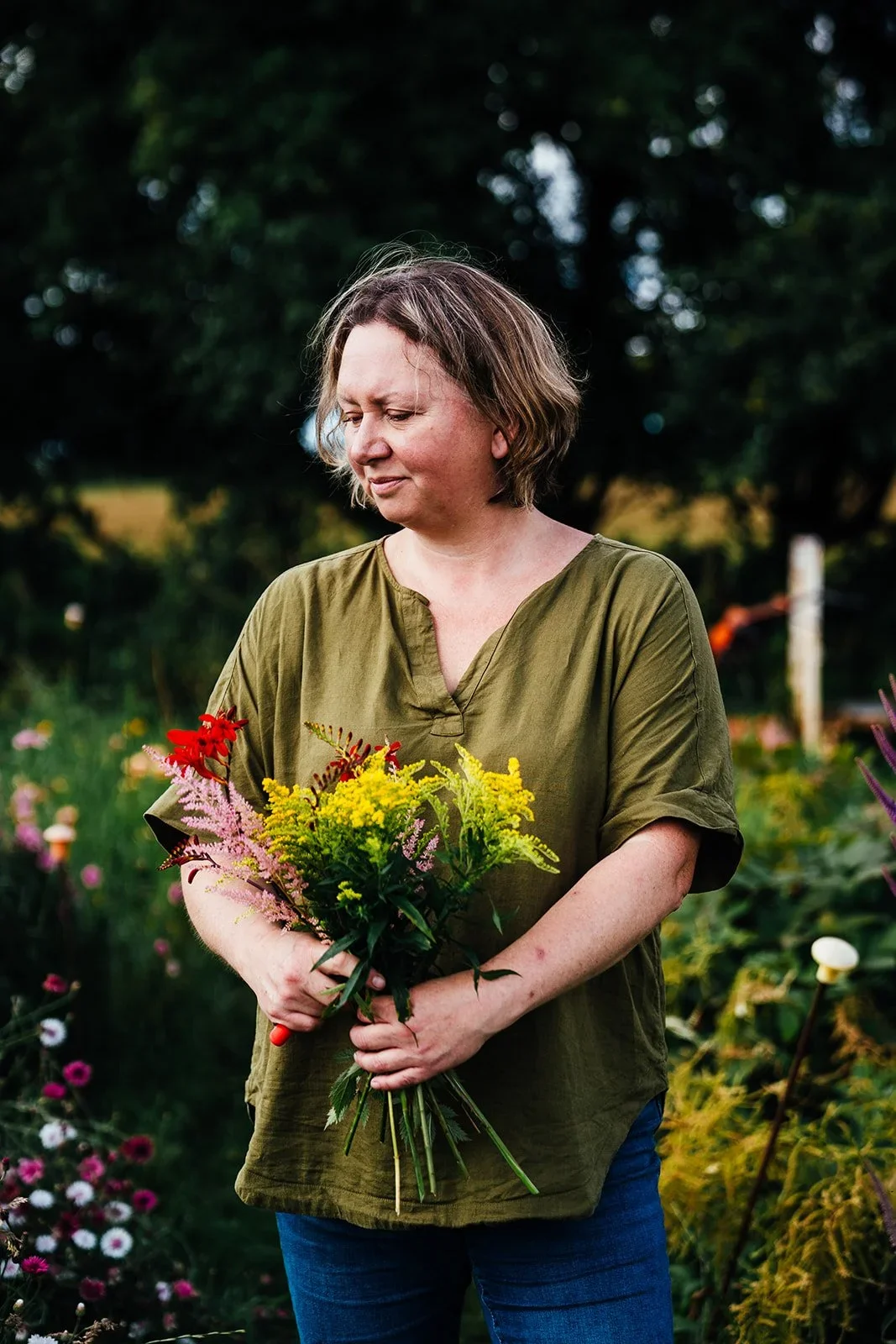 Harriet holding yellow flowers