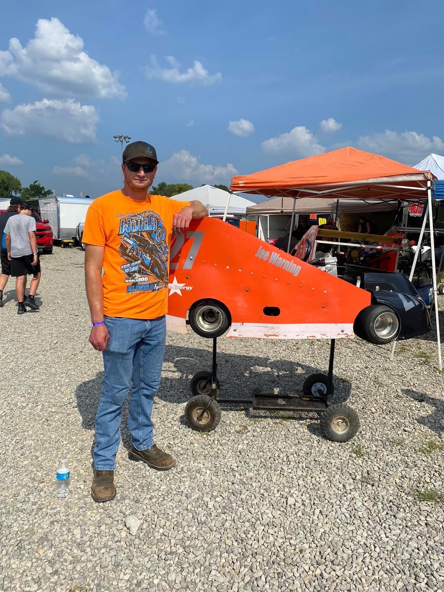  Joe Warning with the kart he was driving for his father’s race 