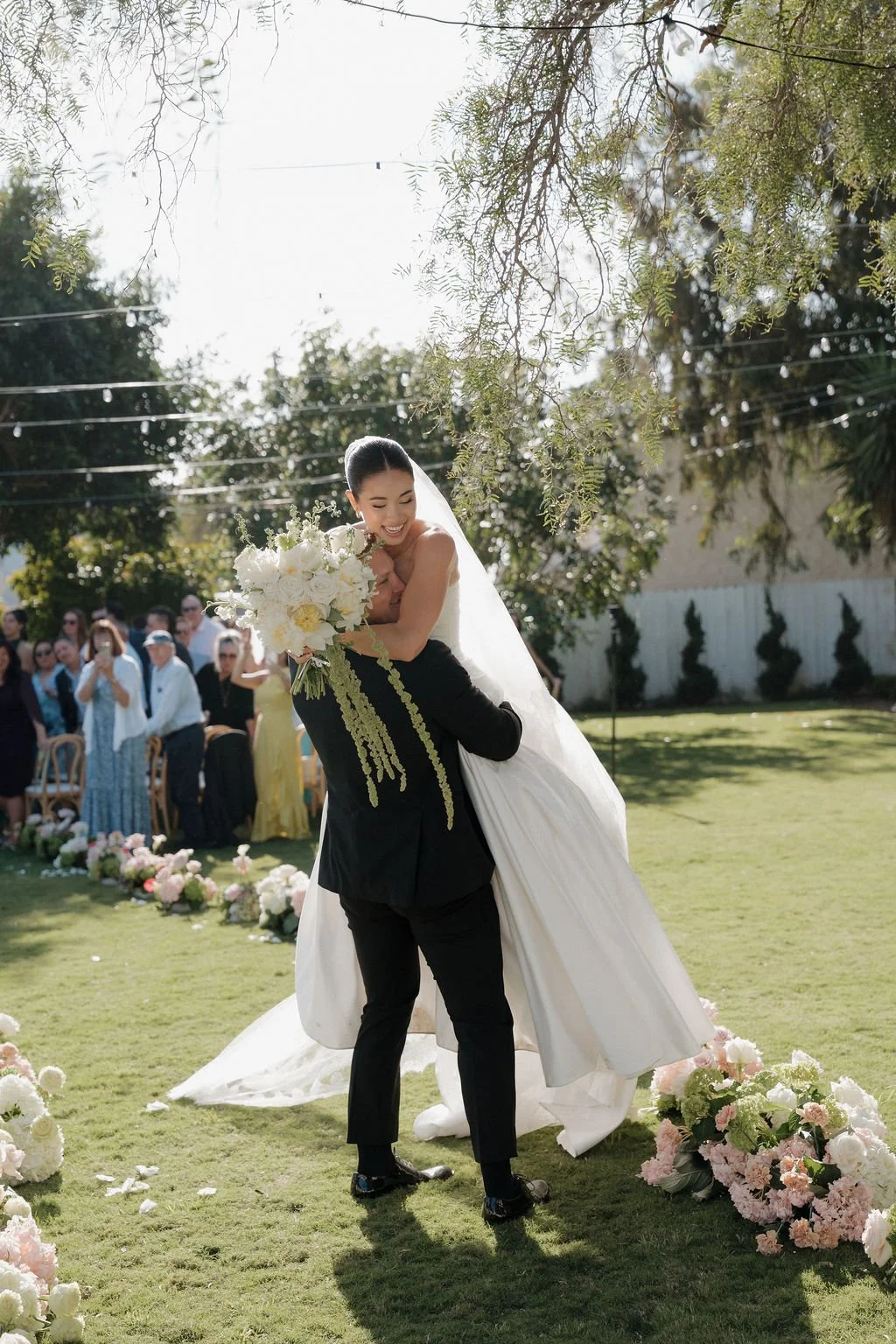 Bride & Groom celebrating after their San Diego wedding ceremony