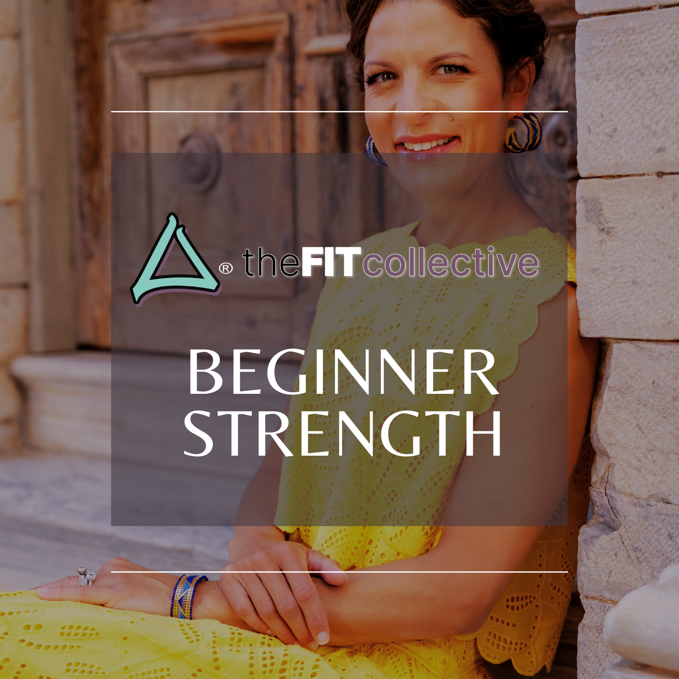 Woman sitting outdoors leaning against a stone wall, wearing a yellow dress, smiling at the camera.