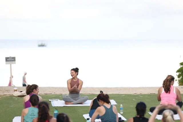 Group yoga by the water