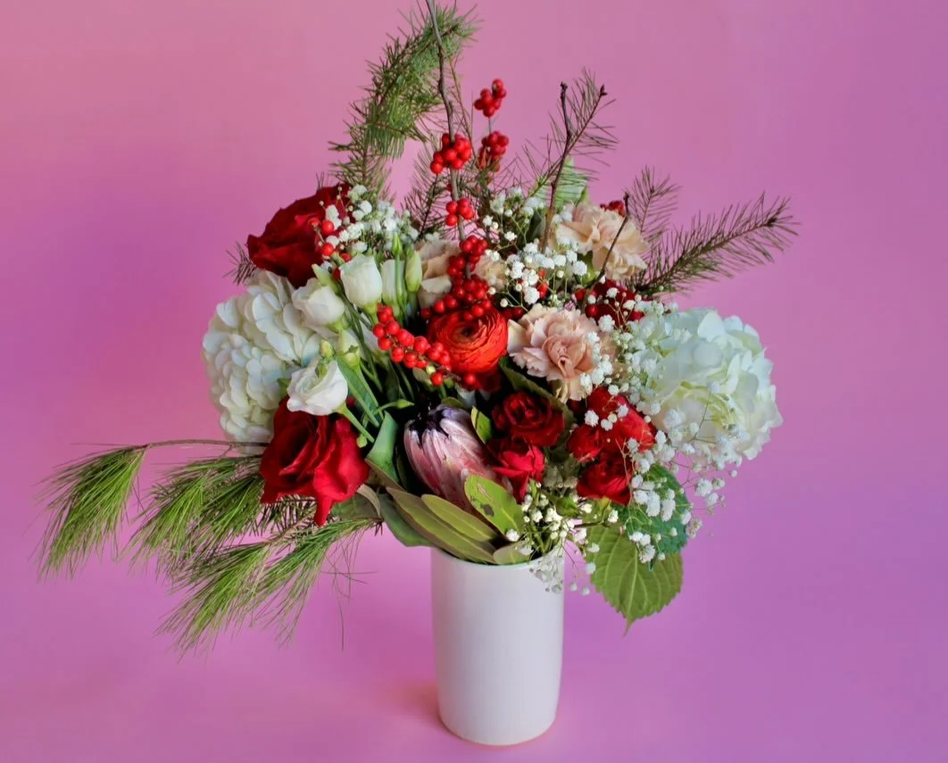 The only way you should be bringing your holiday blooms to holiday parties and gatherings is all dolled up in a vase, of course!

Arrive in style and bring your flowers in a vase to create the perfect holiday centerpiece.

Pictured is Cheery &amp; Br