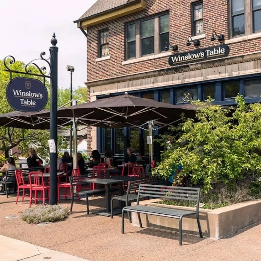 Outdoor patio seating at Winslow's Table in the DeMun neighborhood of St. Louis, Missouri, a popular local breakfast spot near Rudy's Flower Truck.