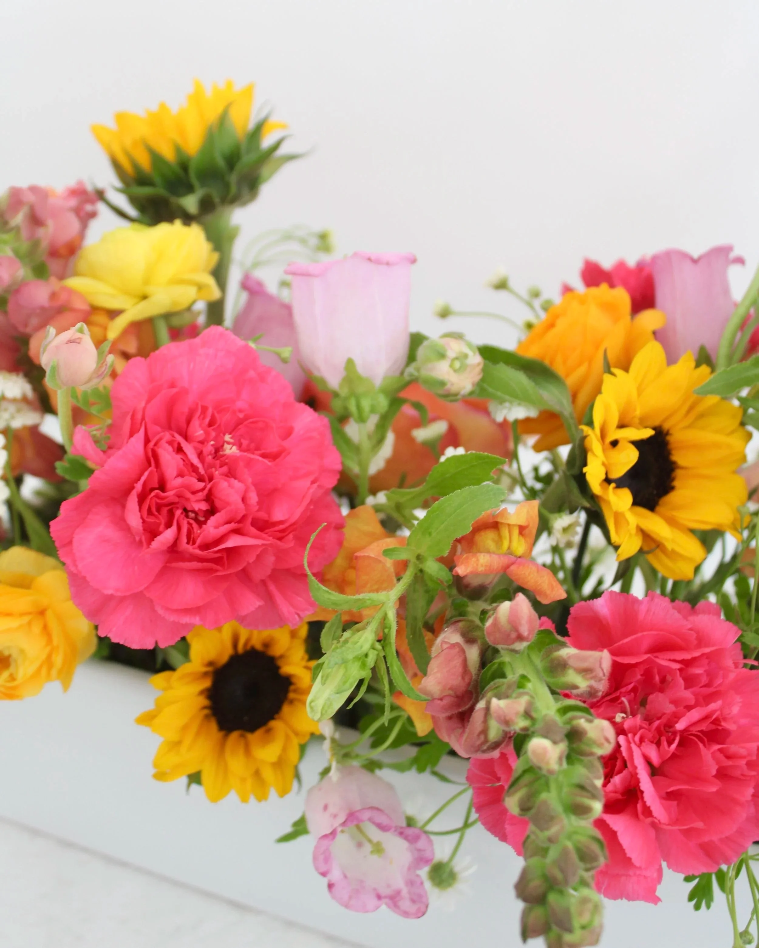 Cheery long and low sympathy arrangement, funeral flowers St. Louis sympathy flower delivery St. Louis condolence flowers bereavement flowers send sympathy flowers local flower delivery St. Louis sympathy bouquets