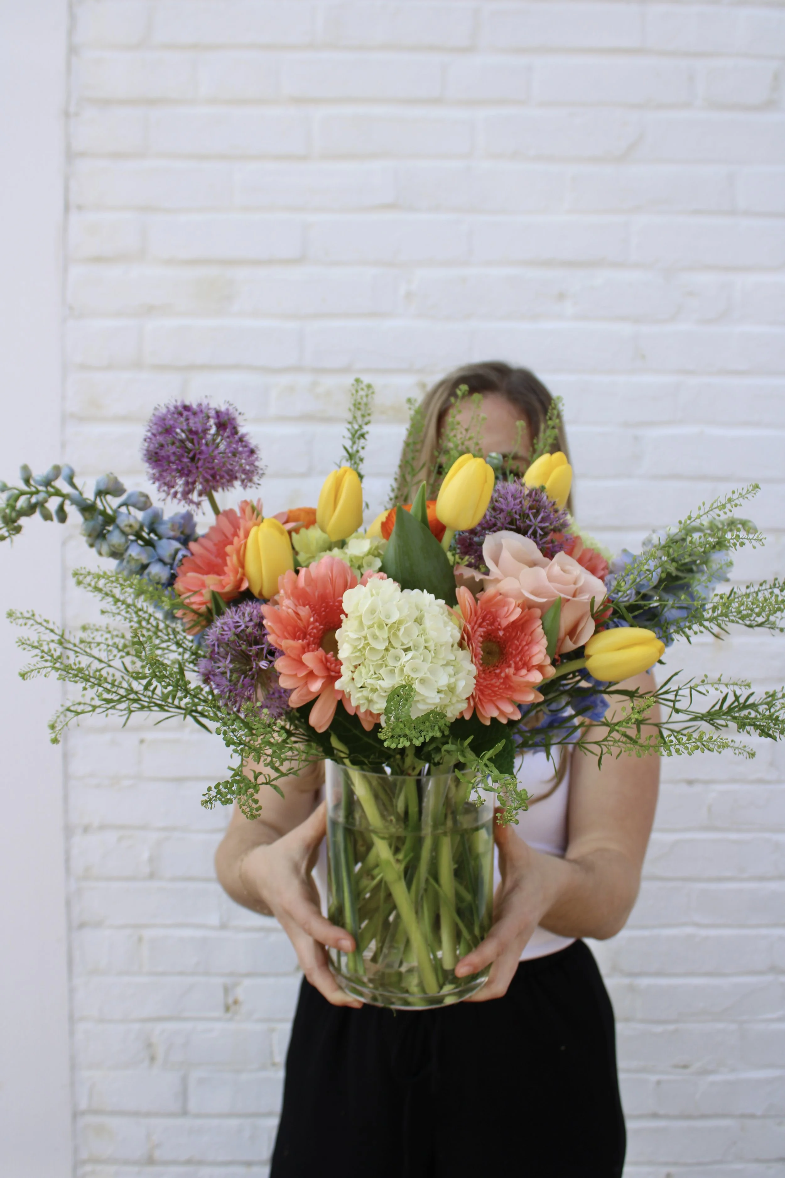 colorful large bouquet wrapped in brown paper, st. louis florist, same day delivery, stl weddings