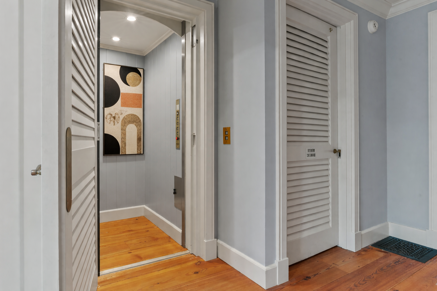 Modern elevator with abstract art.png