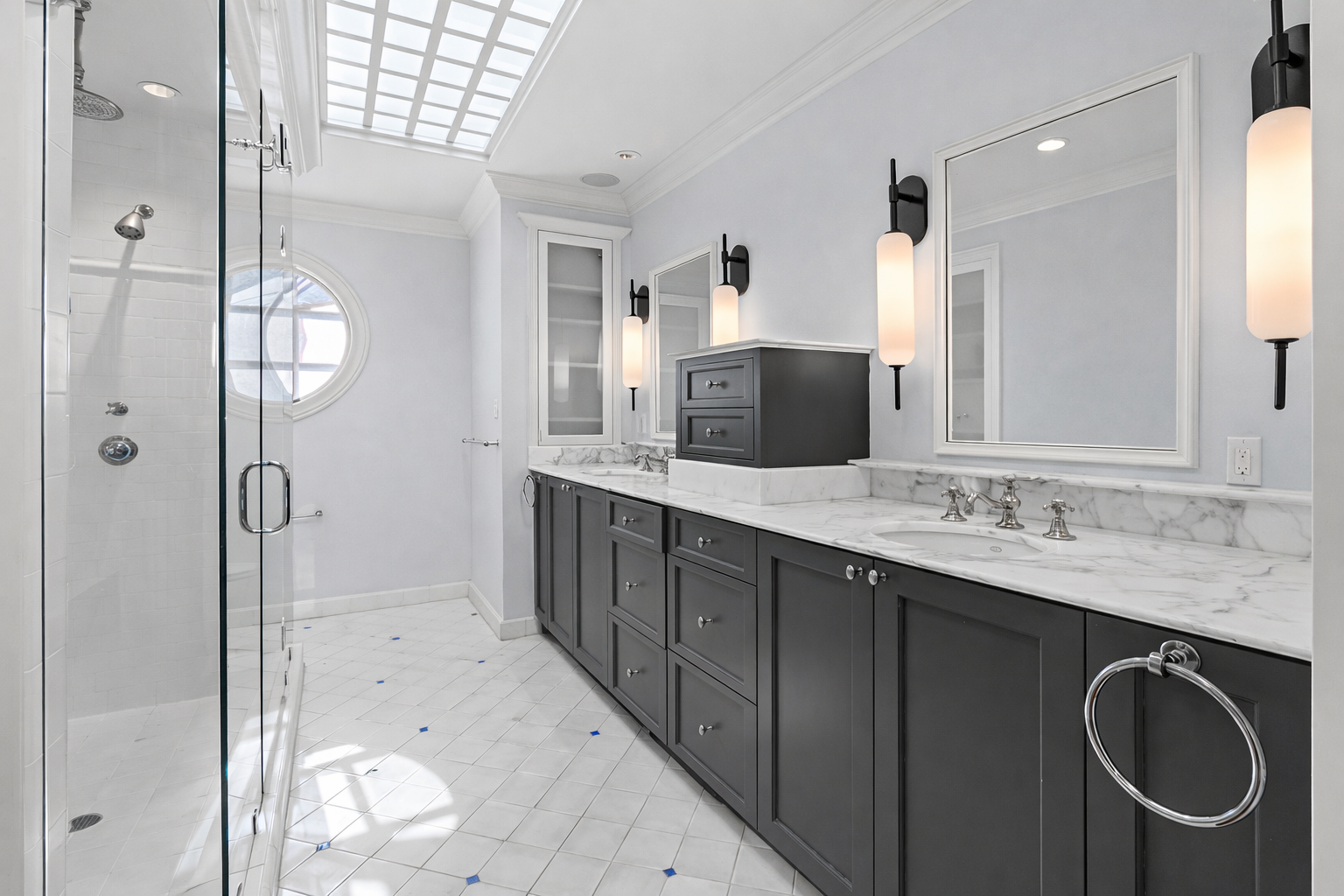 Elegant bathroom with glass shower.png