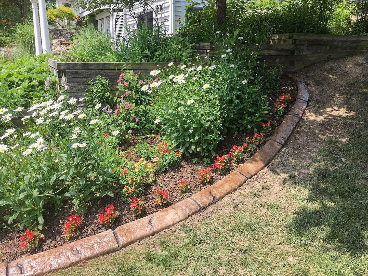  garden bed with perennials | landscape edging by H&amp;M Landscaping 