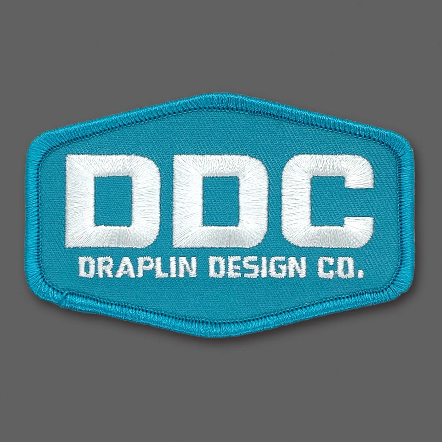 DDC-002 “DDC Logo - Turquoise/White” Souvenir Patch