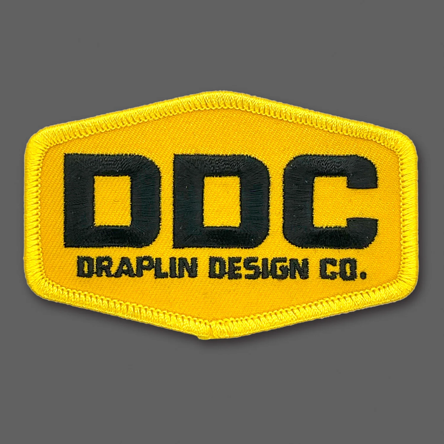 DDC-002 “DDC Logo - Yellow/Black” Souvenir Patch
