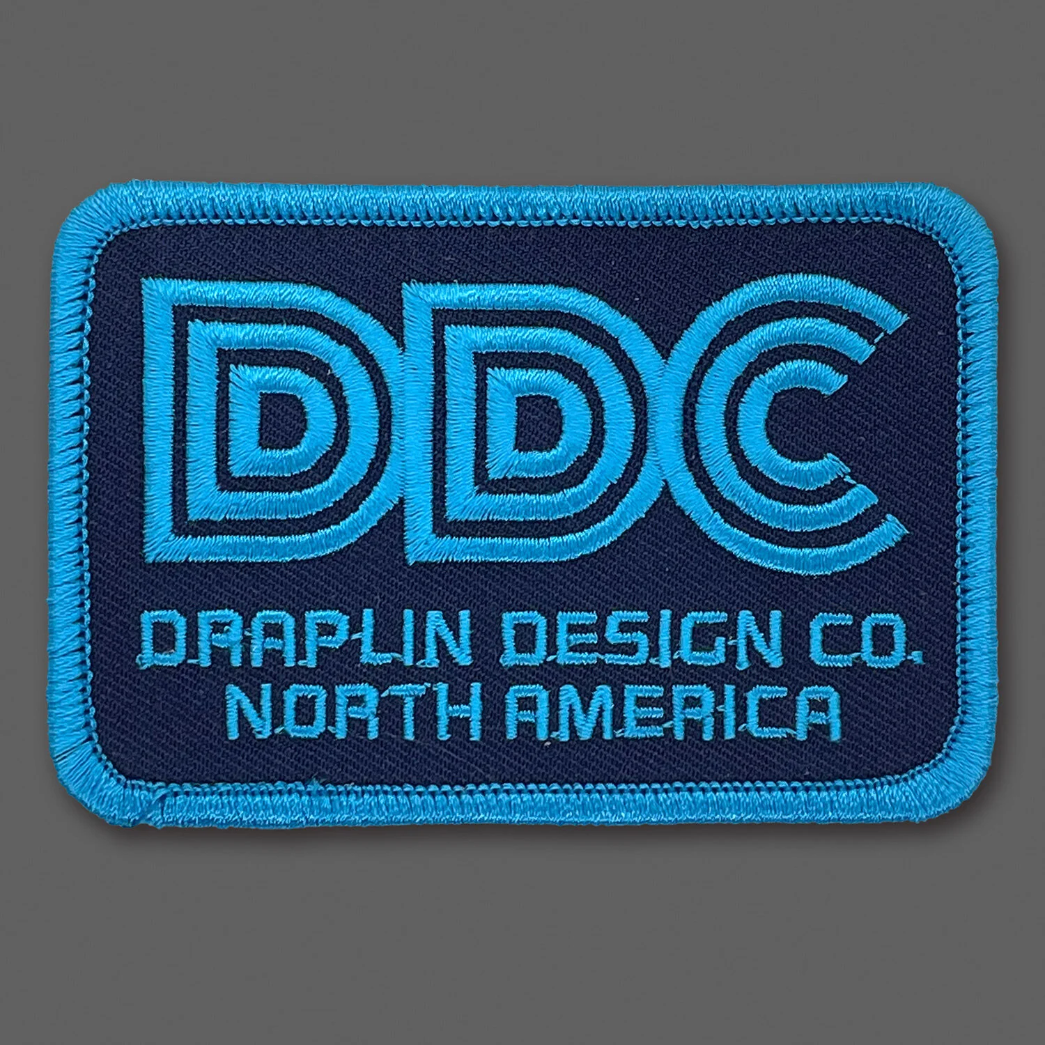DDC-159 “Thick Lines DDC - Navy/Cyan” Souvenir Patch