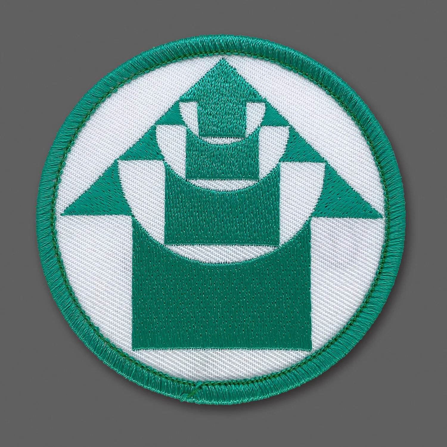 DDC-279 “Expanding Arrow” Teal/White Souvenir Patch
