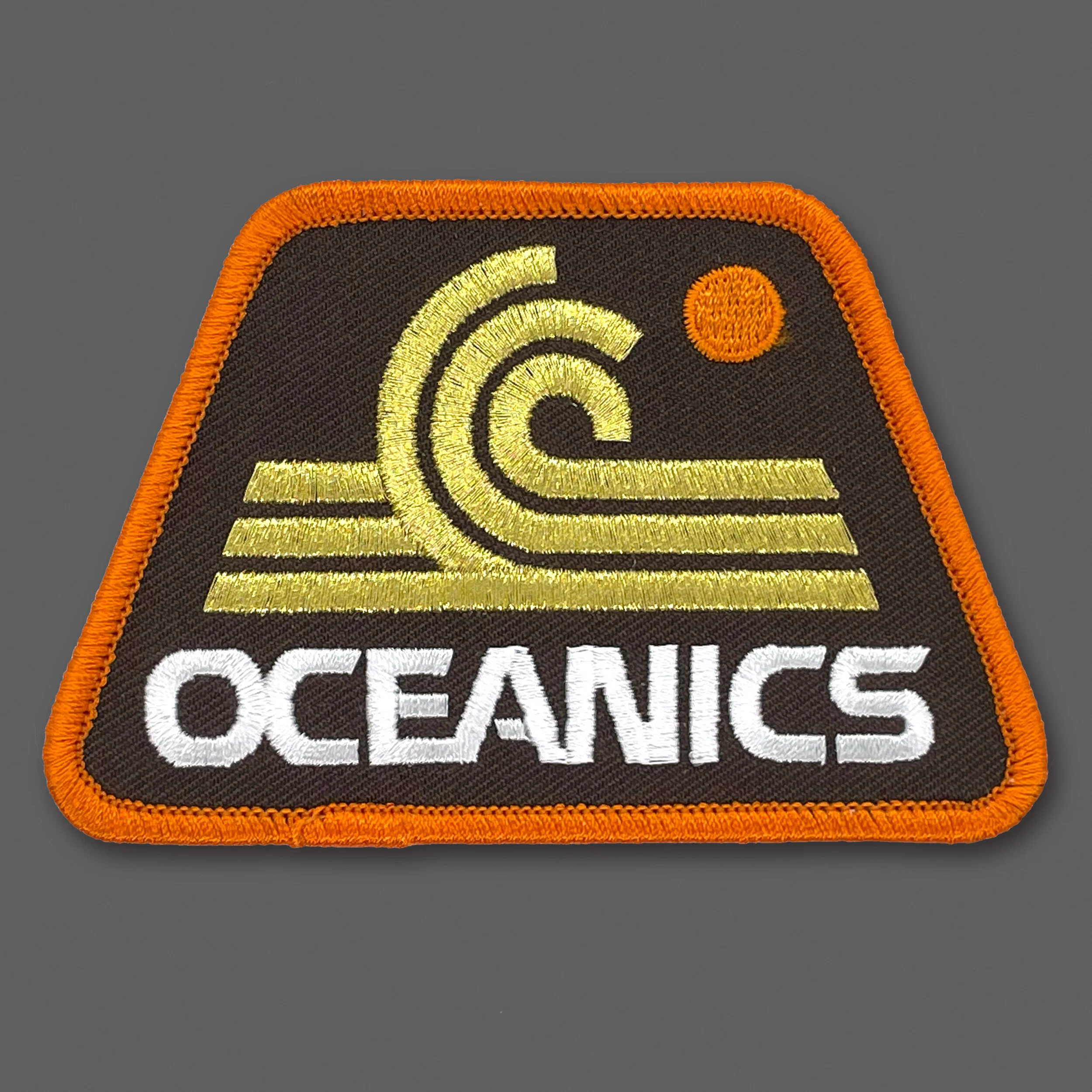DDC-194 “Oceanics - Brown/Gold” Souvenir Patch