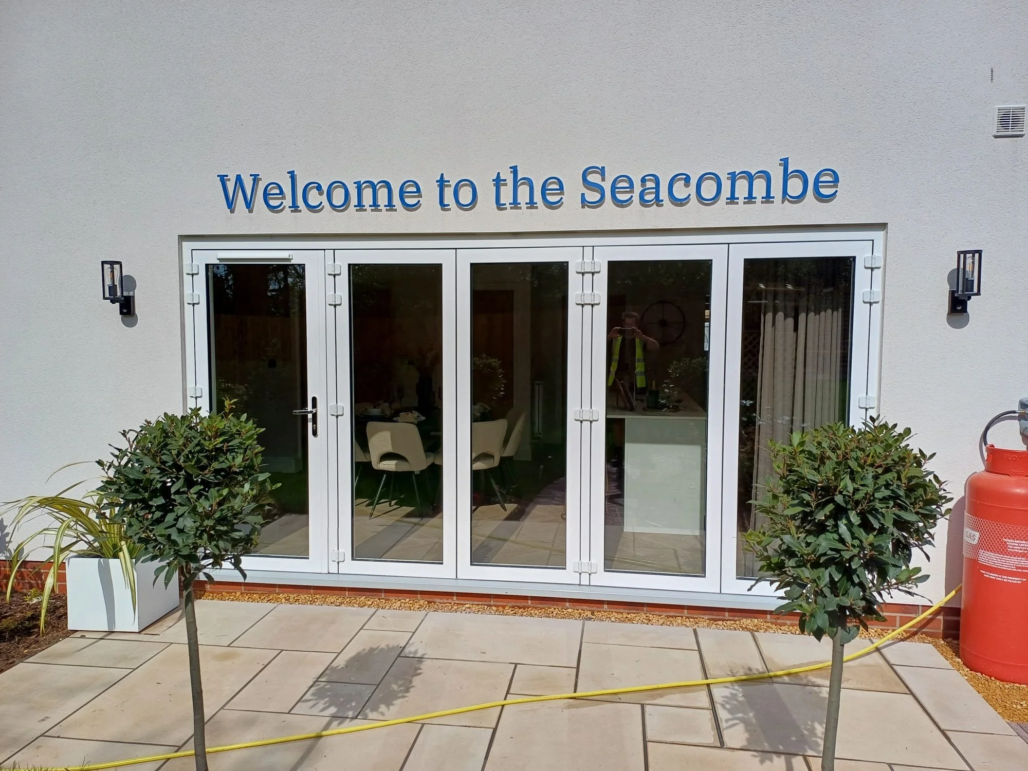 Professional installation of large-scale built-up letters for a home builder client Charles Church.