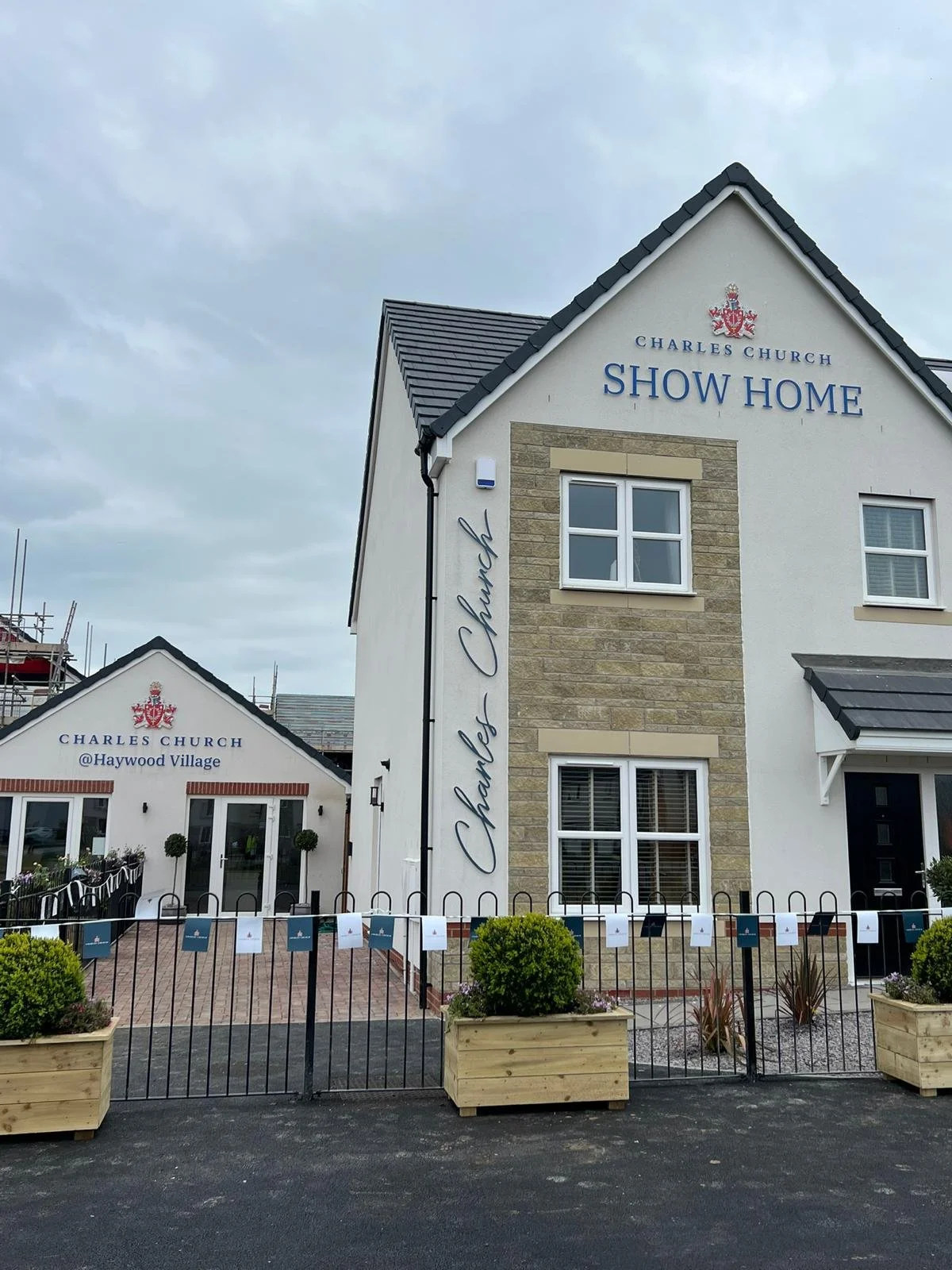 Professional installation of large-scale built-up letters for a home builder client Charles Church.