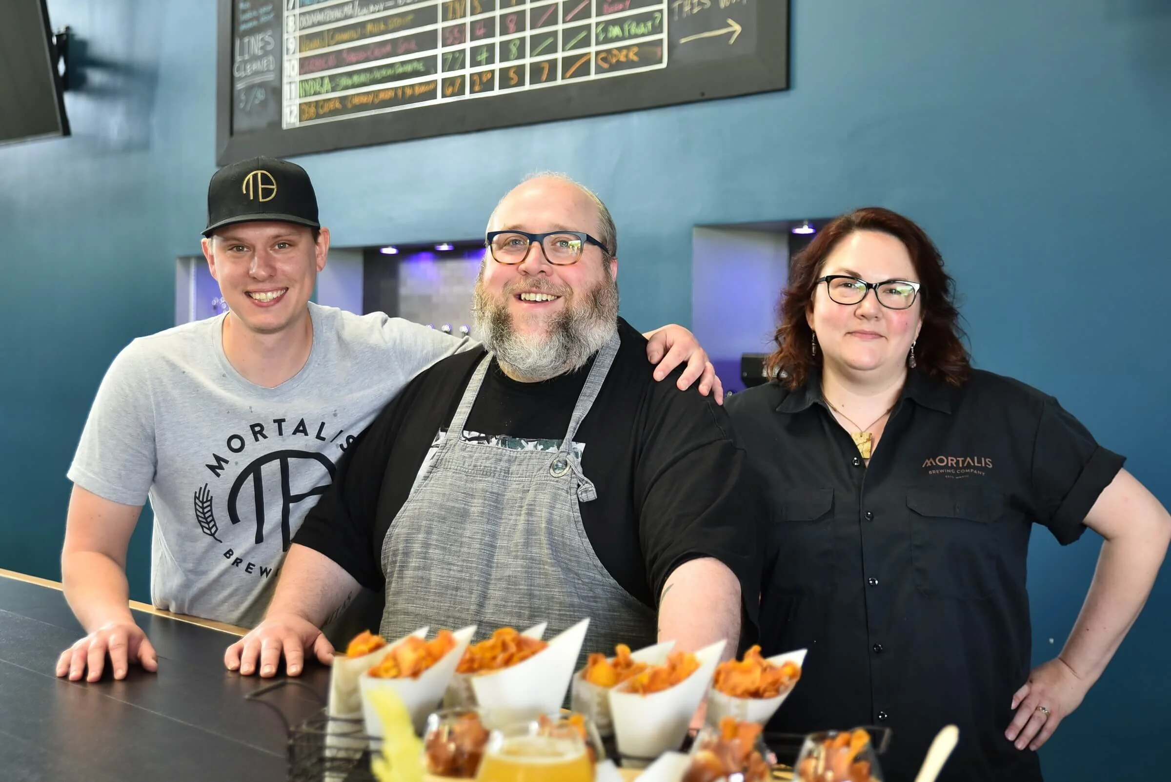 Mortalis_People_Behind_Bar_Owner.jpg