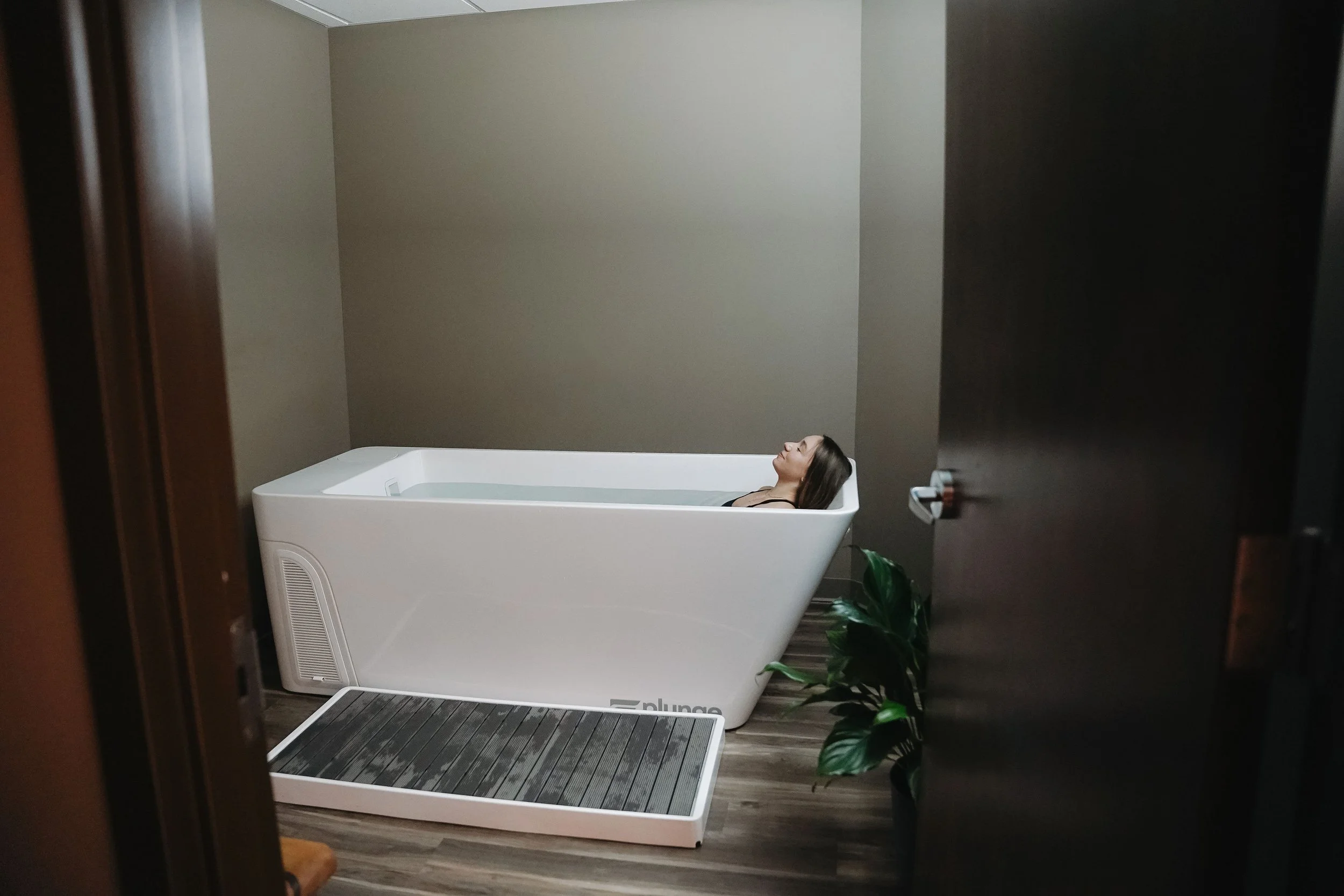 Wide shot of a woman inside ice bath at Cedar House Wellness.jpg