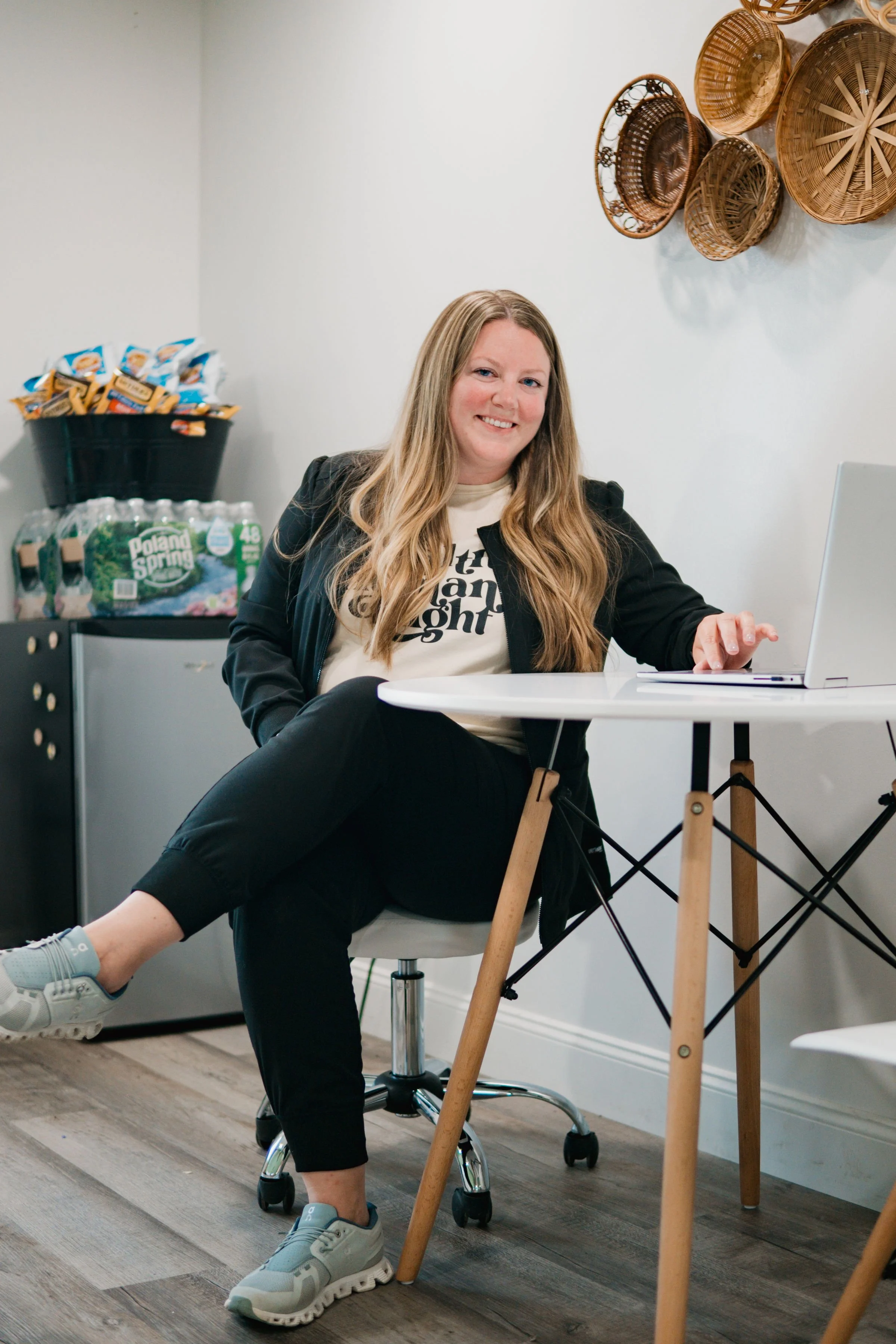 Amy Hayes sitting at table at Native Wellness Lakeville.jpg