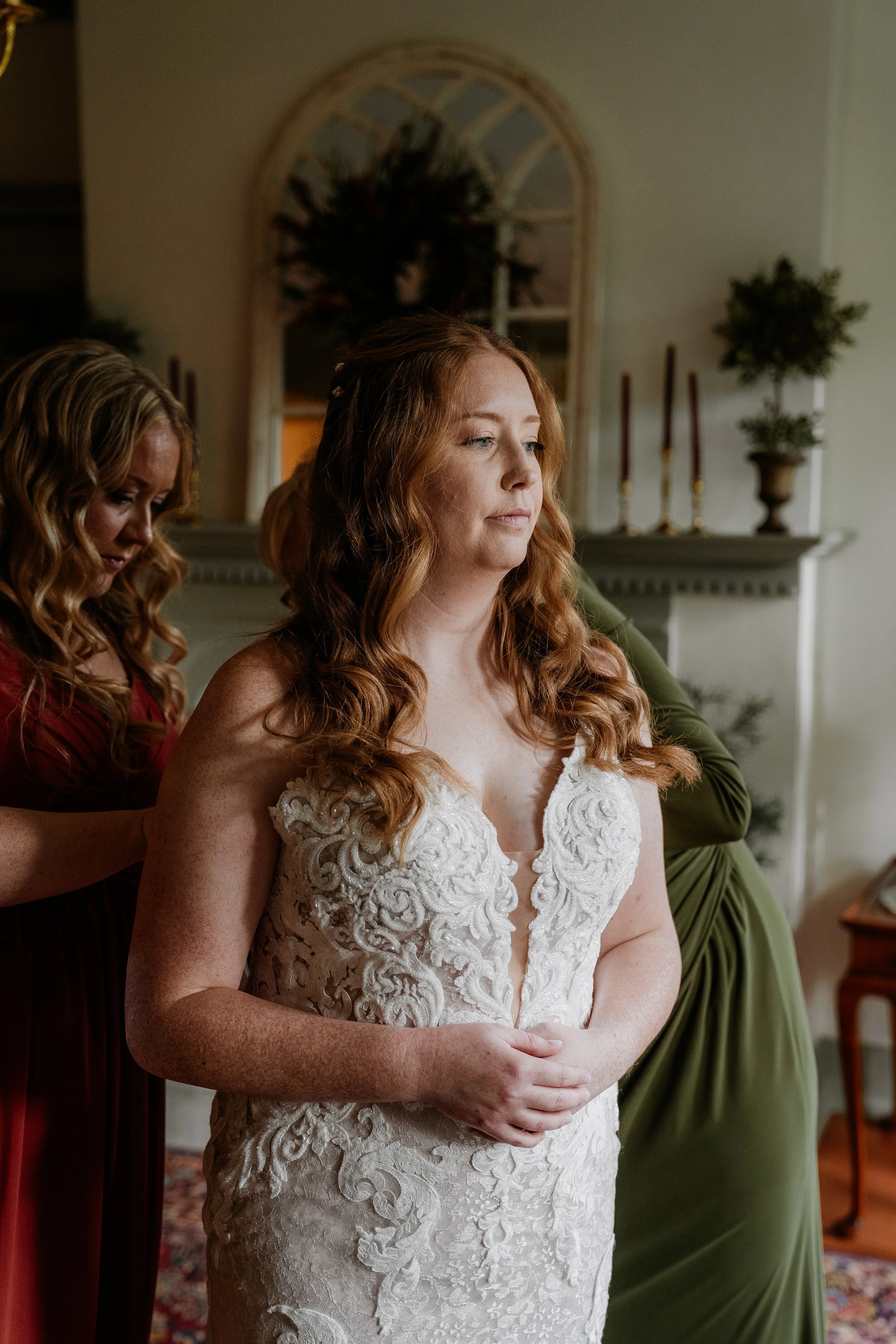 Bride getting ready with bridesmaids in bridal suite at Stone Mill Inn in Hallam, PA