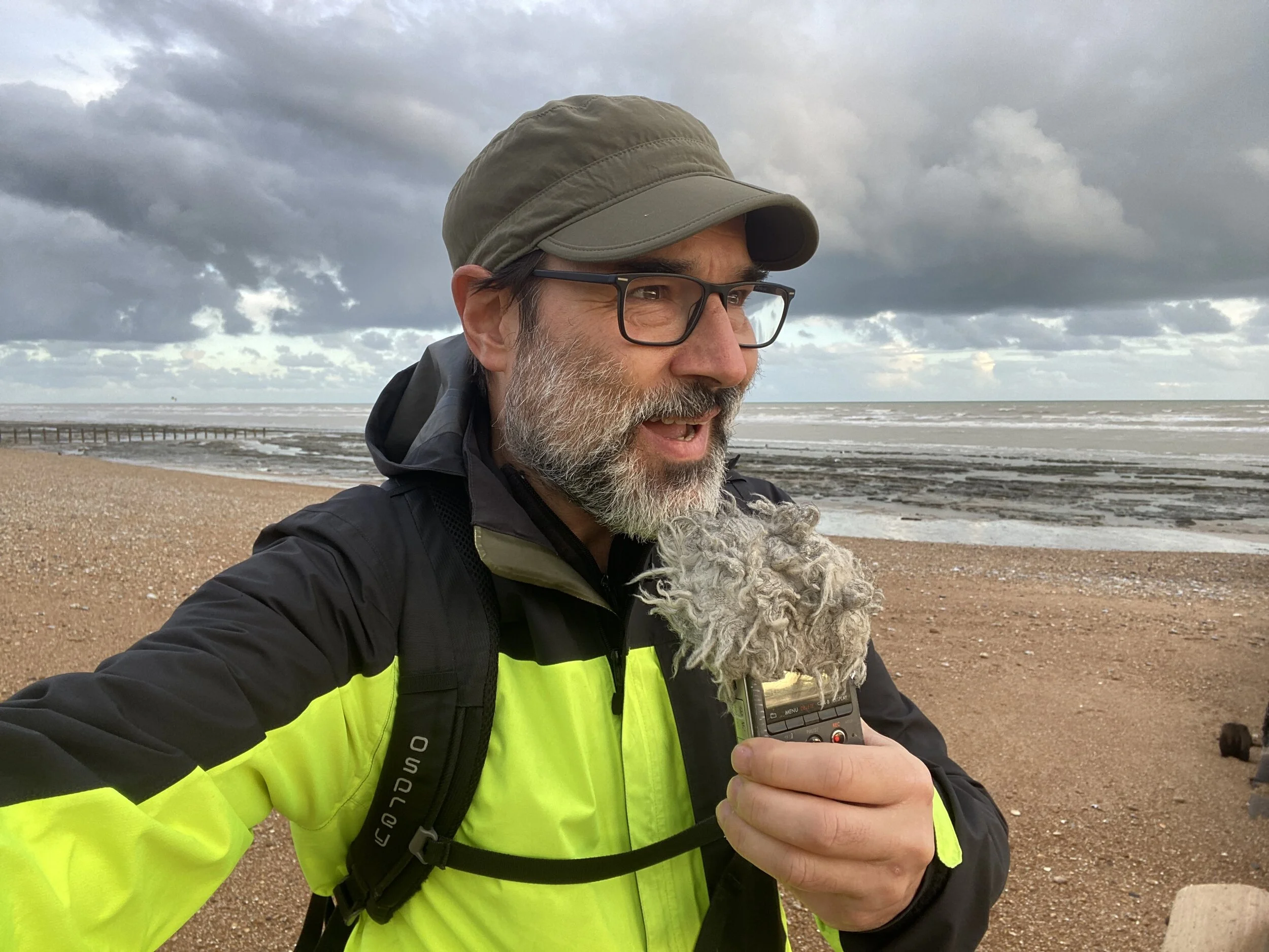 A Buckles recording podcast intro and looking at the sunset, Cooden Beach, Bexhill on Sea, October, 2021