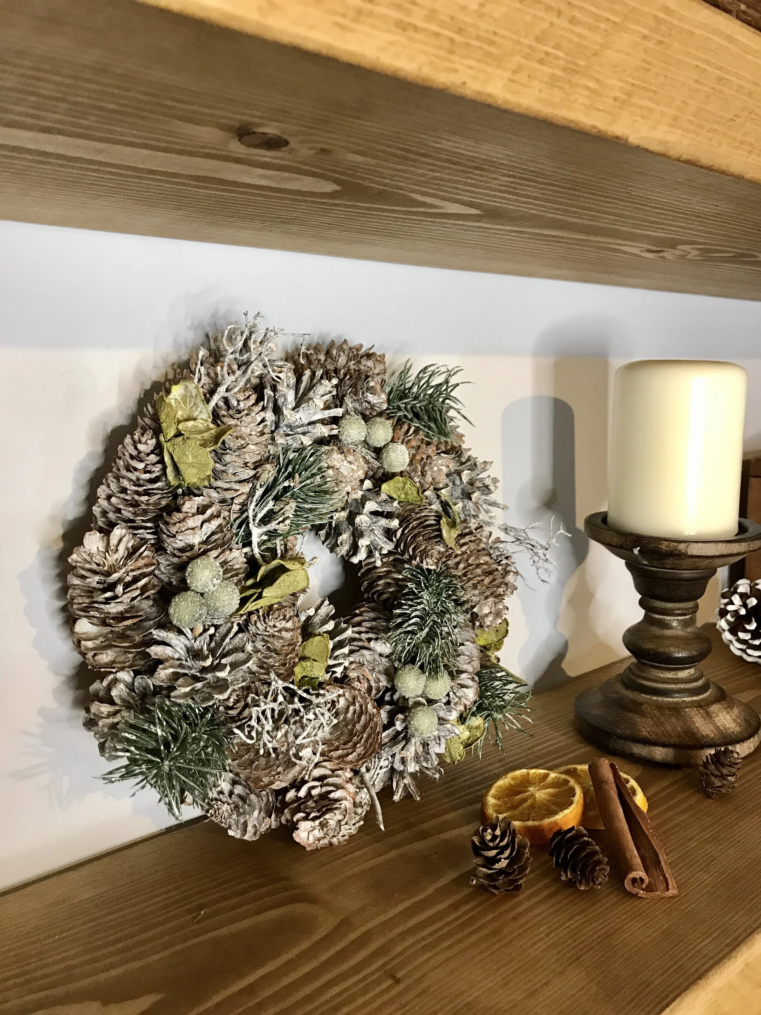 snowy frosted pinecone wreath