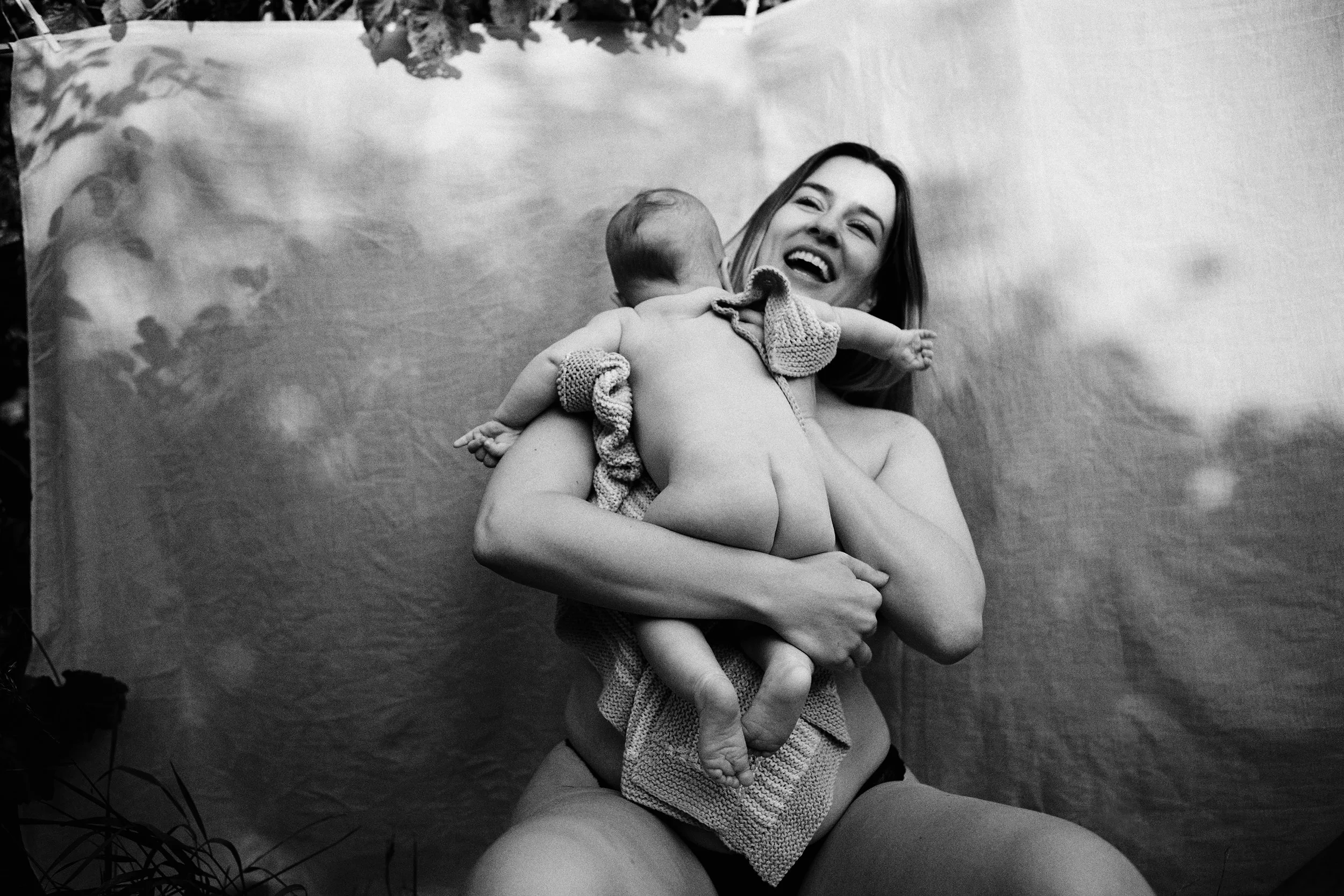 mother baby black white natural linen backdrop outdoor