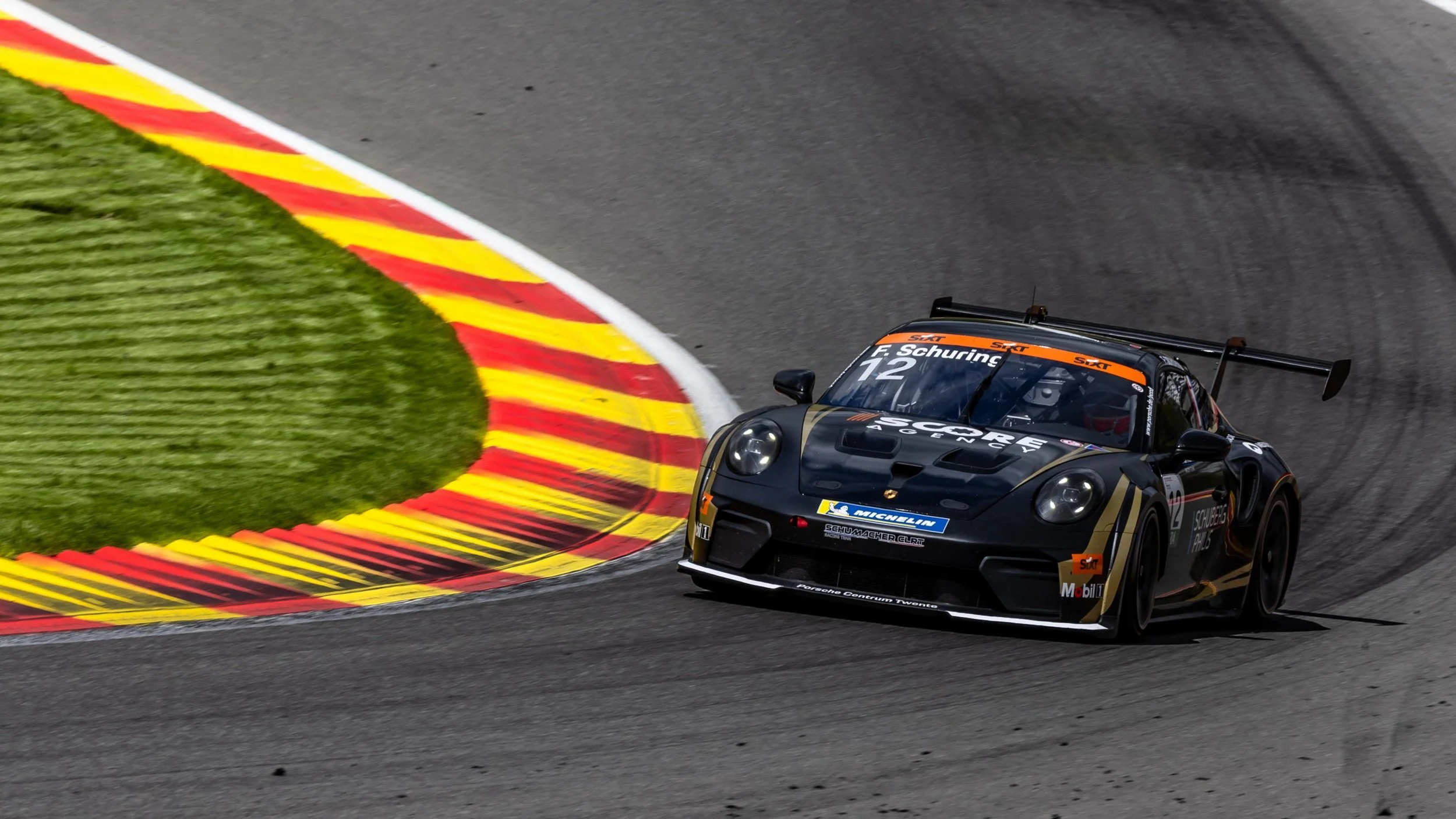 Porsche Junior Flynt Schuring celebrates on the podium in Spa