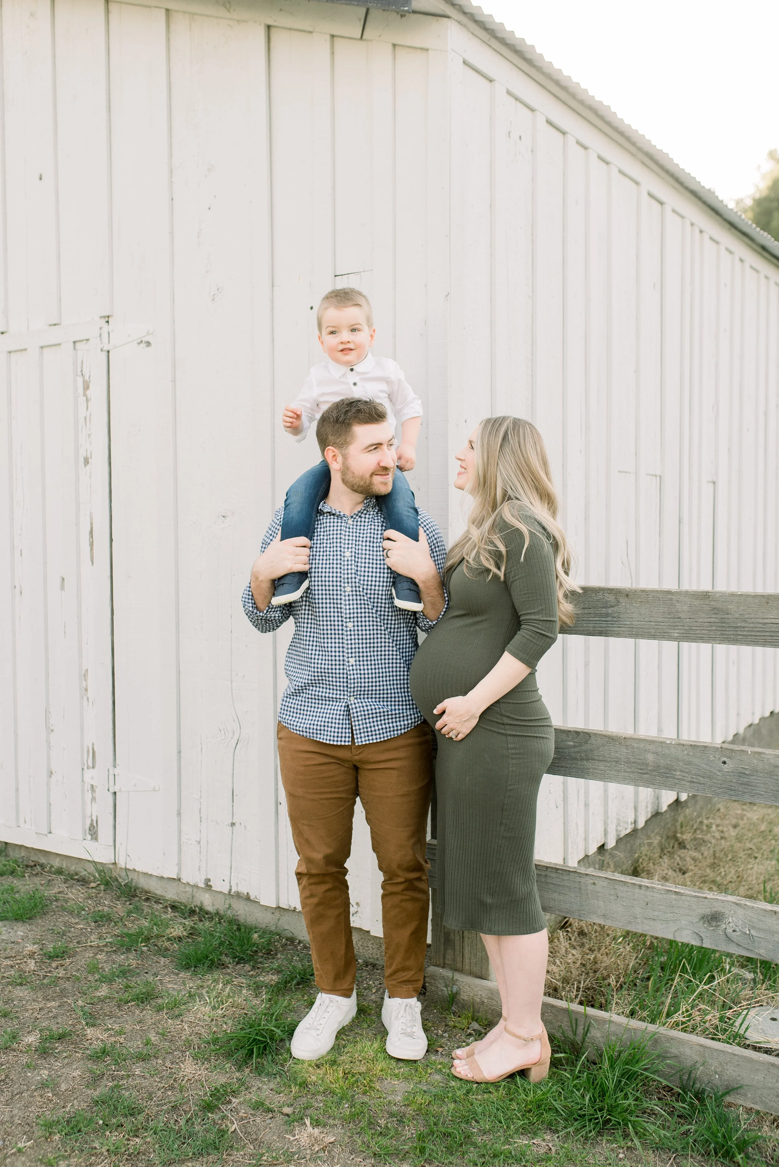 family photo with white barn