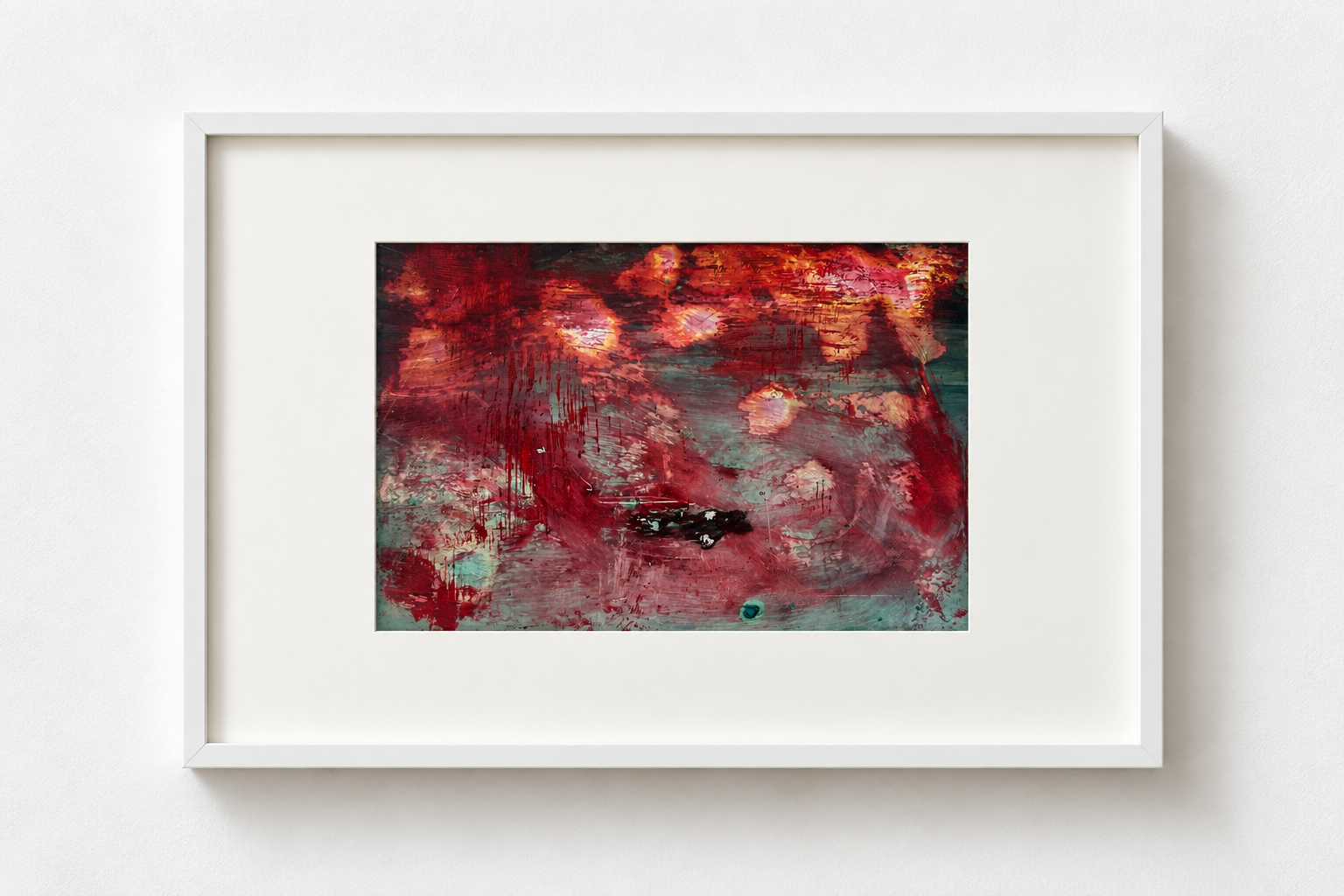 An abstract painting with red, pink, and green colors, framed in white and mounted on a white wall.