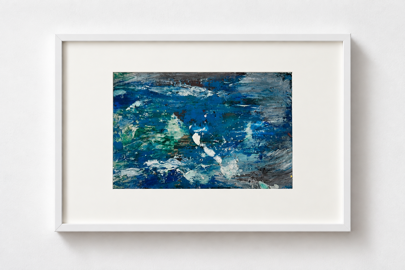 Abstract painting with various shades of blue, white, and hints of green and brown, framed in white and mounted on a white wall.